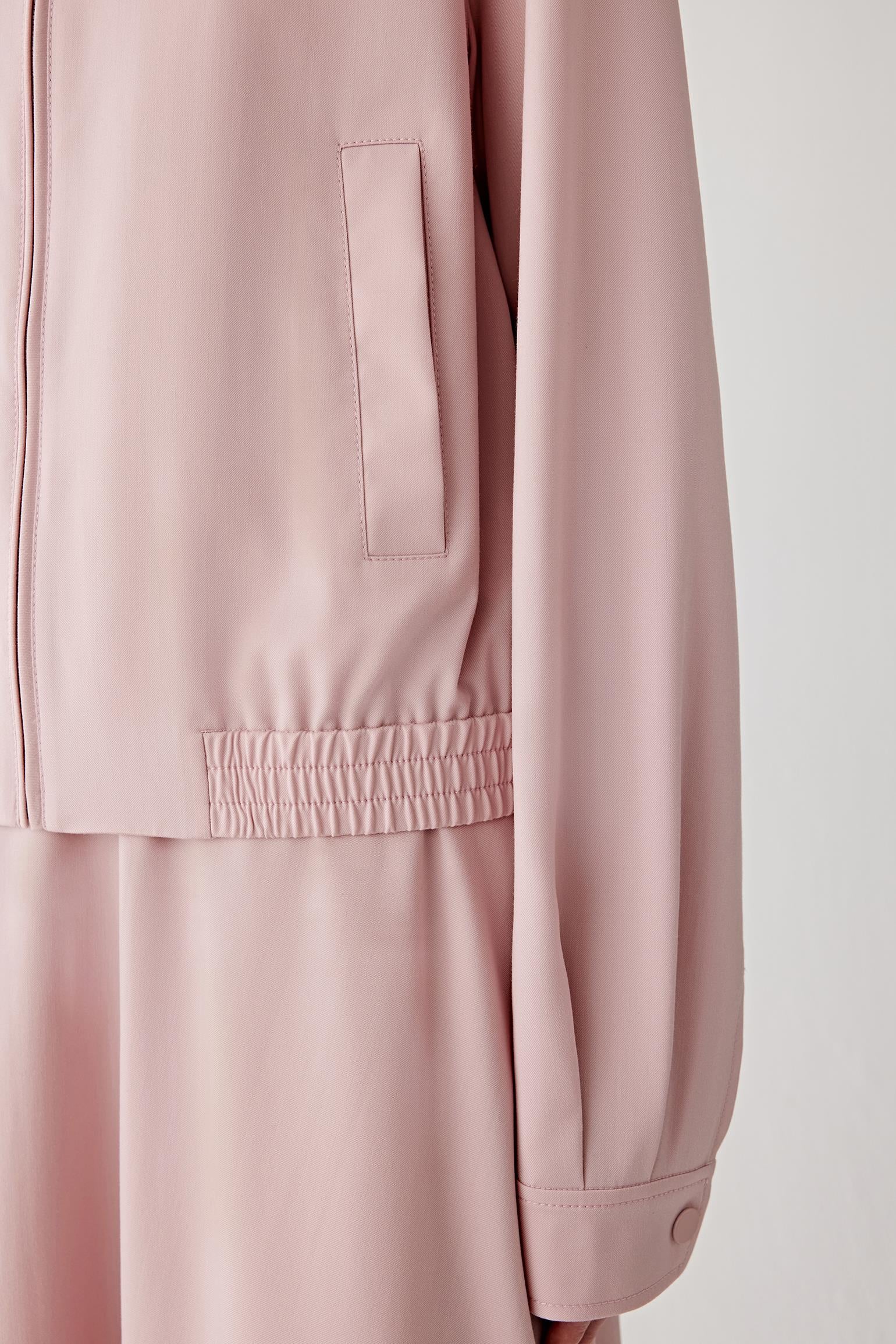 Close-up of the sleeve and cuff, showing smooth seams and a clean, minimal finish.