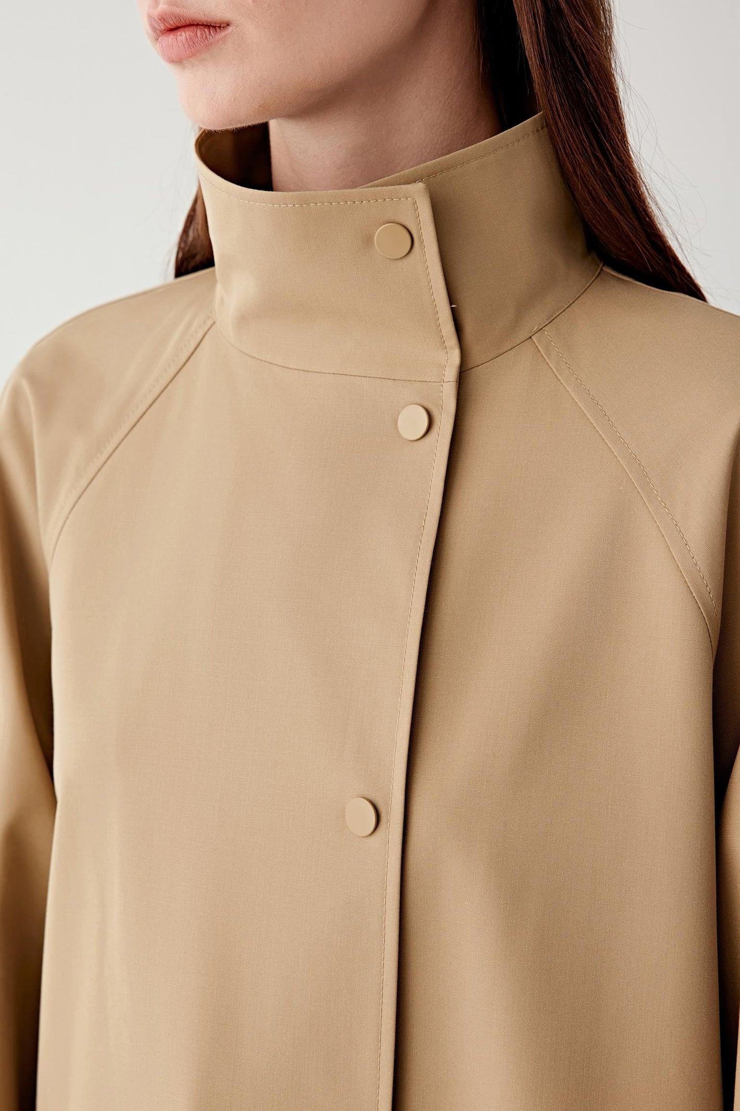 Close-up of the collar and button fastening.