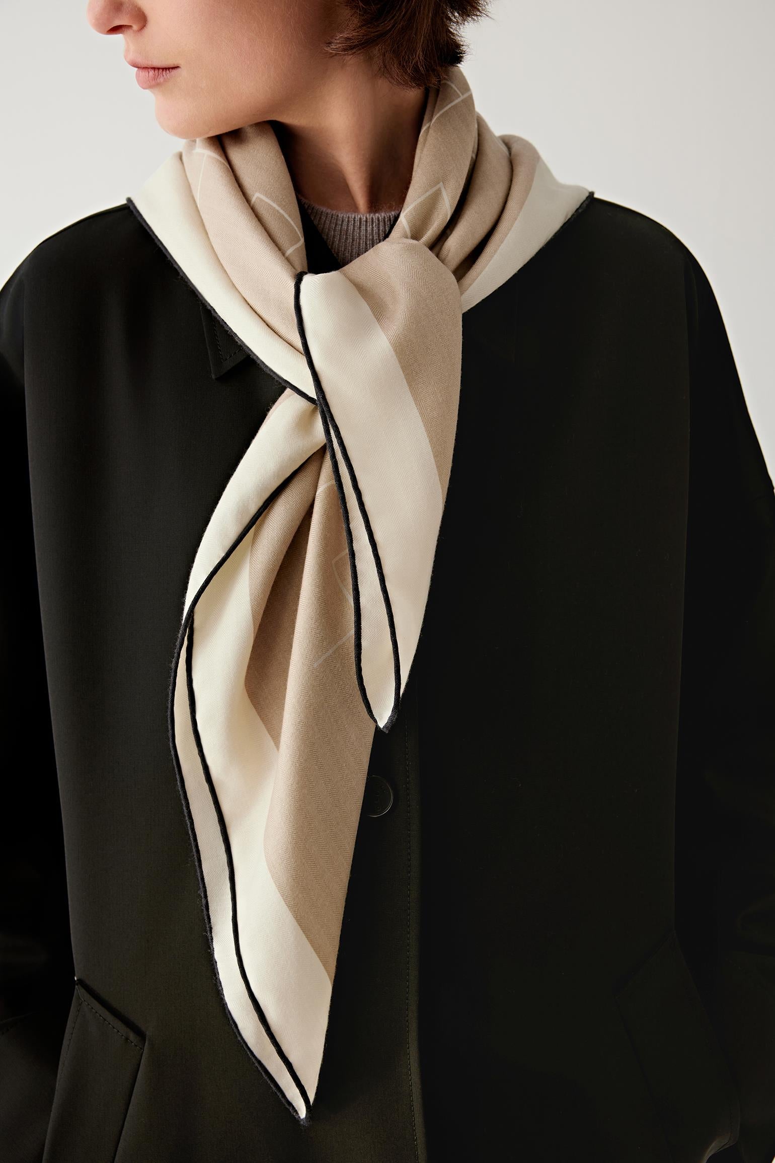 Three-quarter view of the scarf draped naturally around the neck.