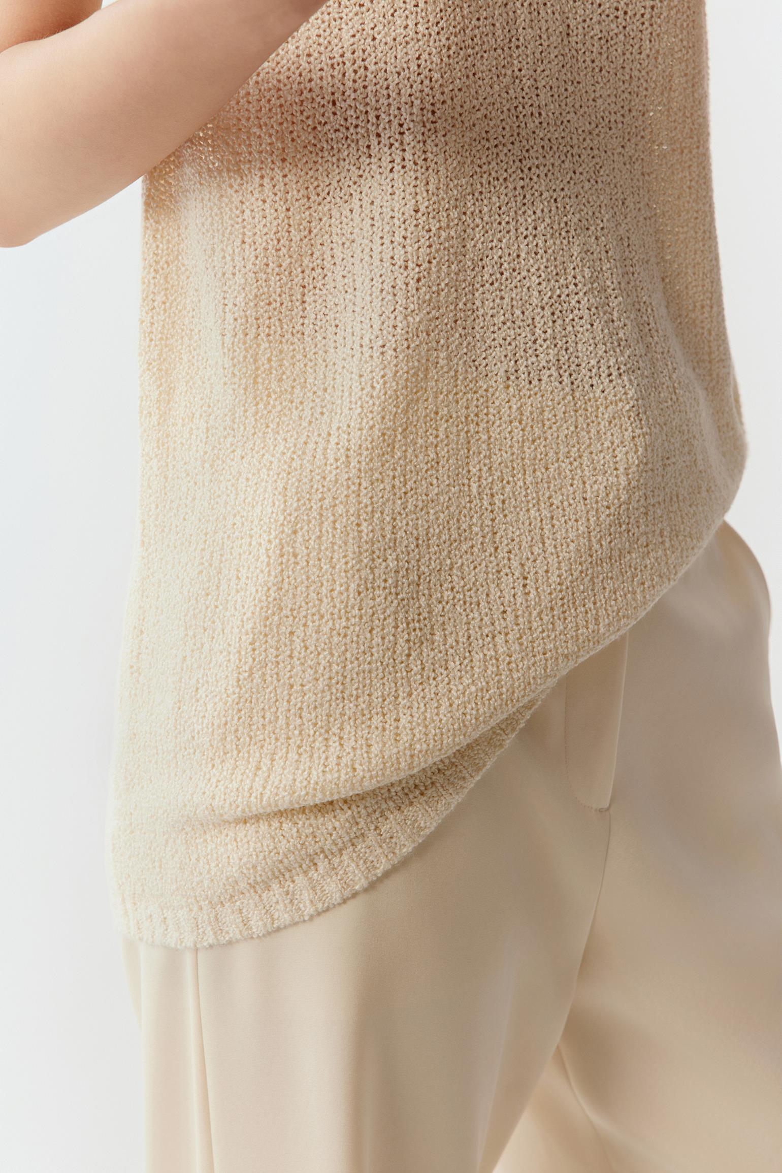 Detail of the fabric and hem, showing the lightweight construction and subtle texture variation.
