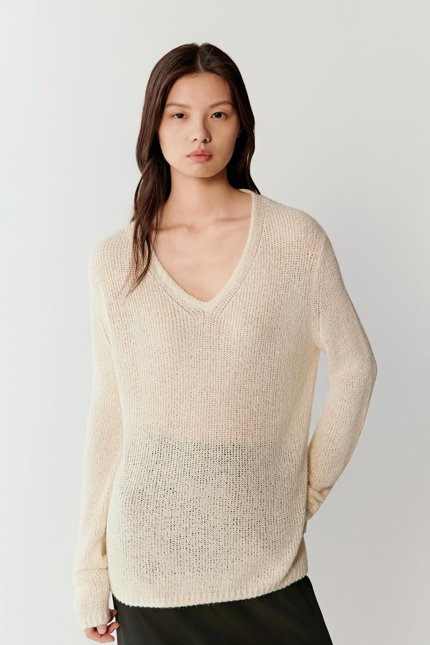 Front three-quarter view highlighting the soft silhouette, natural transparency of the open knit and relaxed fit.
