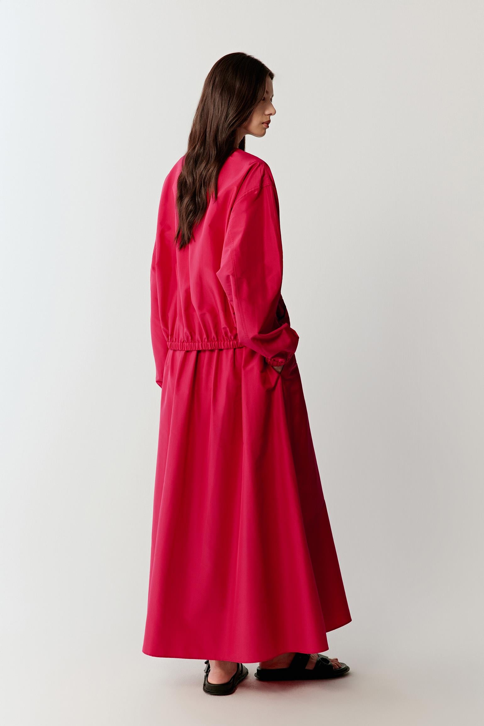 Full-length back view highlighting the rear construction, with gathered volume and a rounded silhouette, showing how the structured taffeta maintains form while creating soft movement through the lower part
