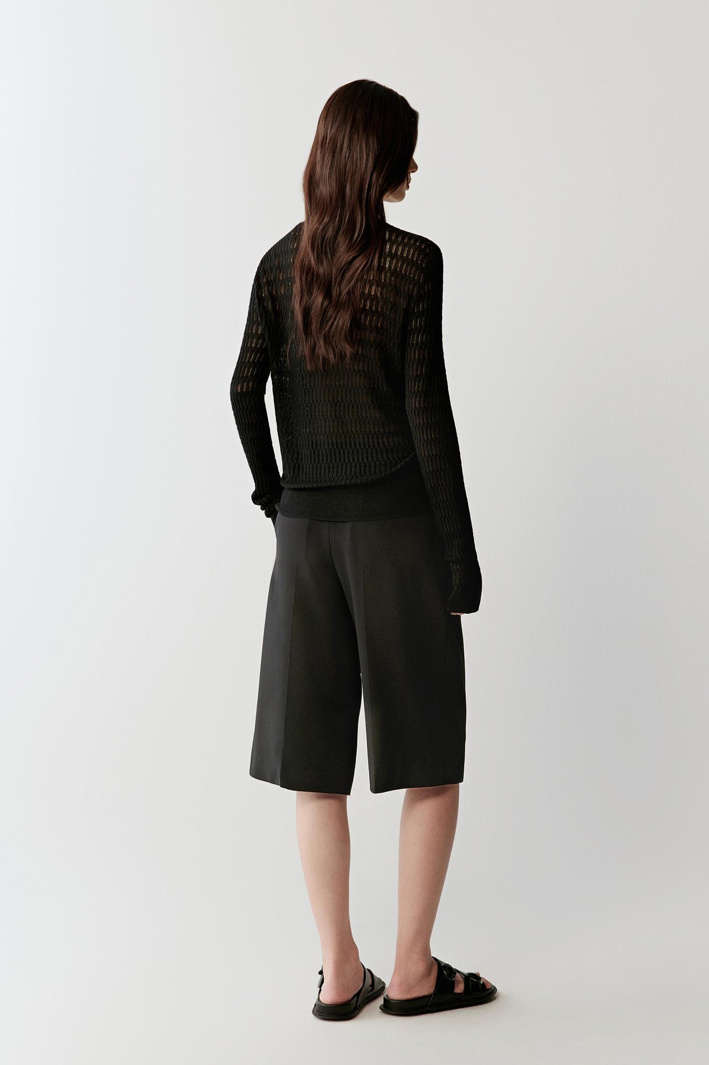 Back view showing the straight fit, clean shoulder line and fluid fall of the knit.