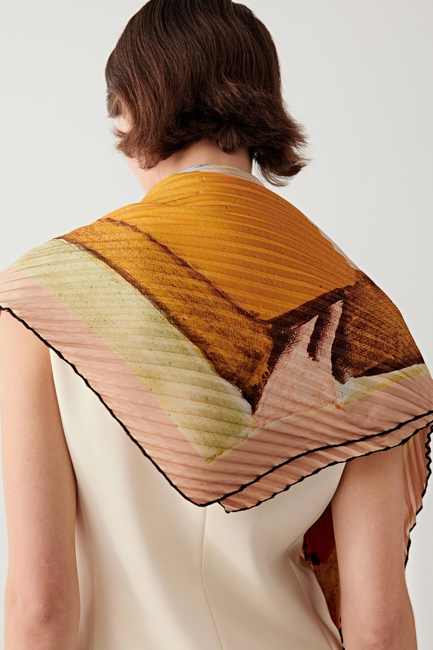 Back view highlighting the artwork composition across the shoulders.