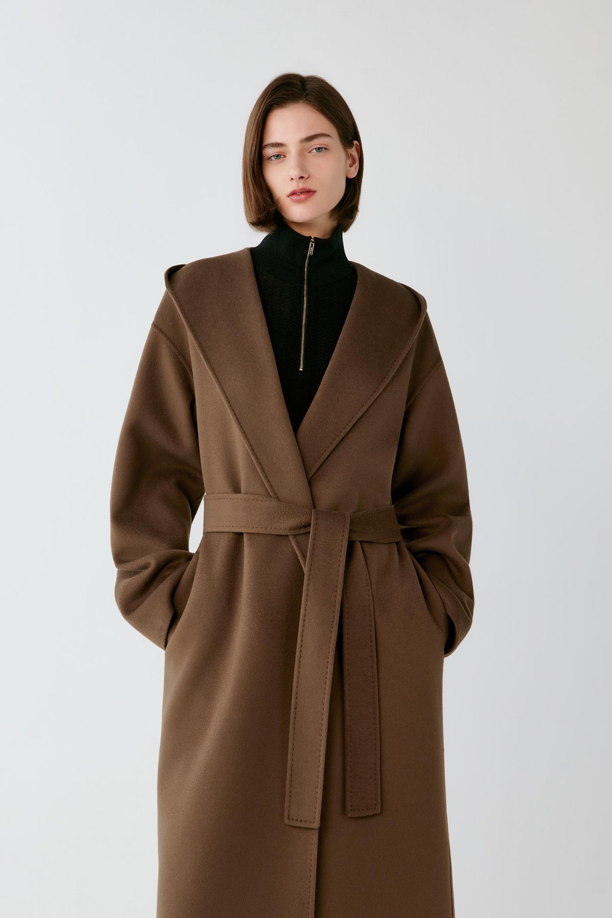 Front view highlighting the hood, wrap construction and self-tie belt of the rich brown double-face coat.