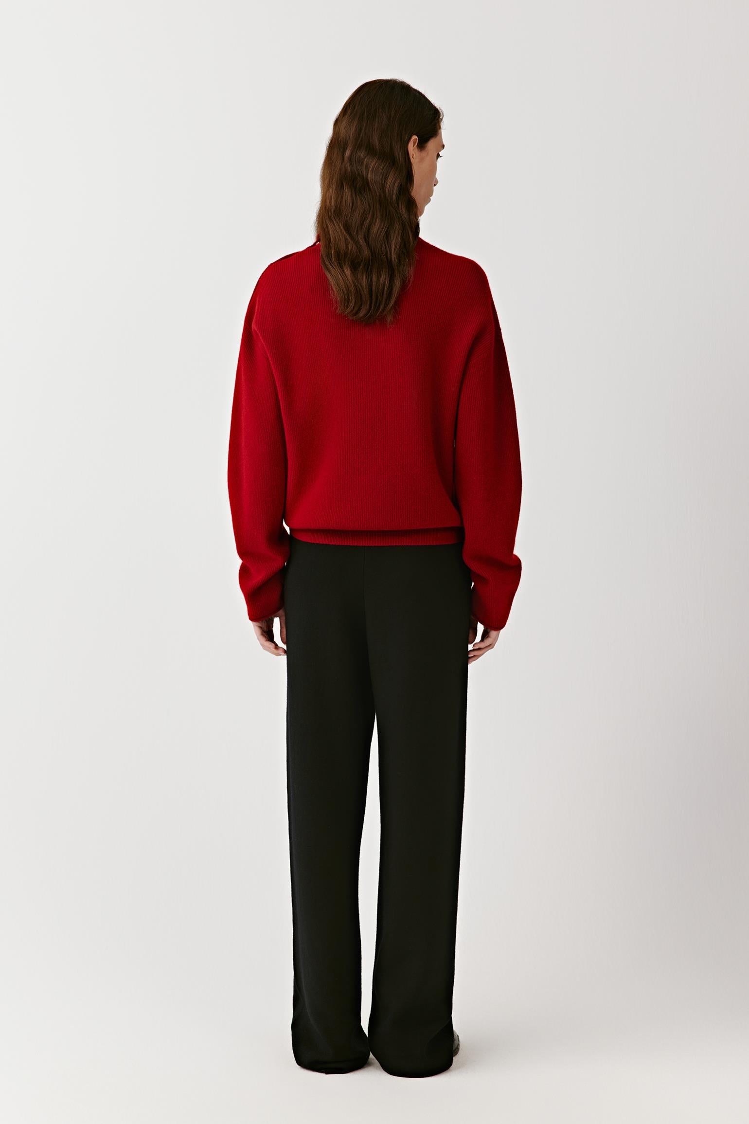 Back view of the red cashmere pullover, showing a smooth knit and straight cut.