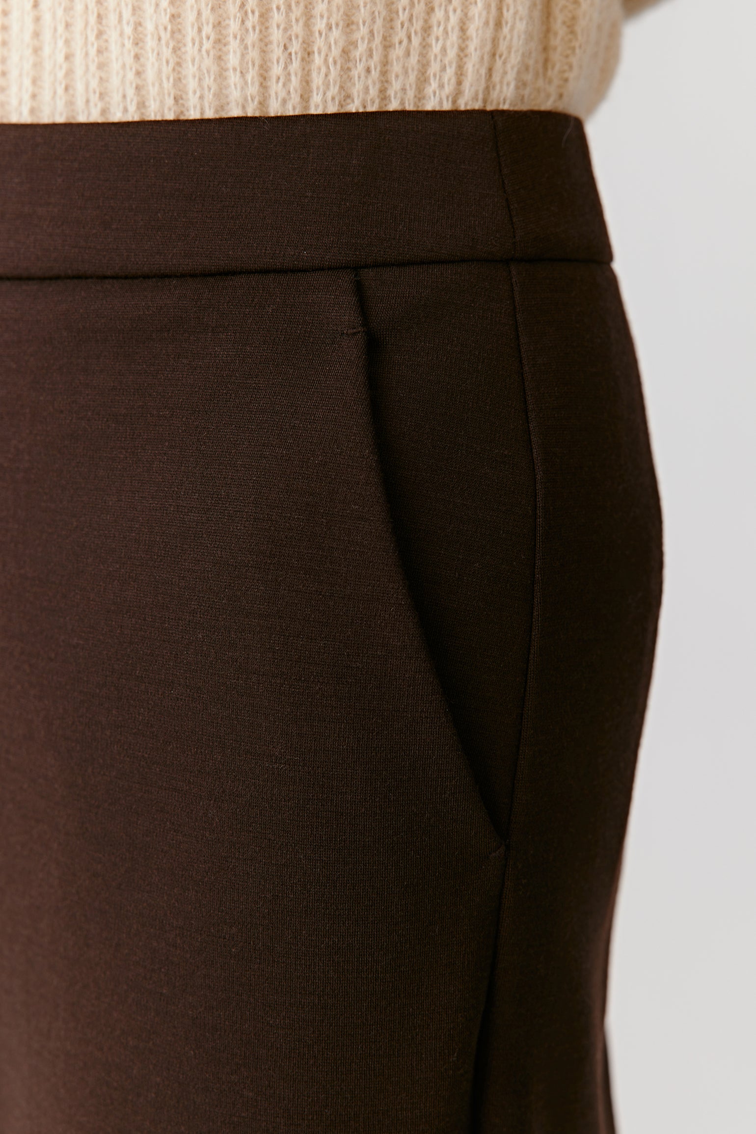 Close-up of the side pocket and fabric texture of the stretch worsted wool trousers.