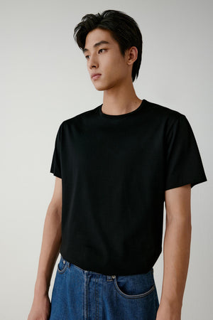 The side angle shows the clean cut of the sleeve and the soft fall of the fabric over the shoulders.