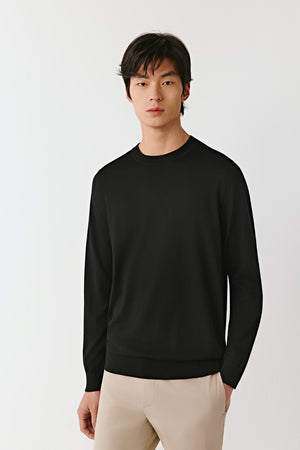 A mid-shot captures the relaxed fit across the shoulders and the refined finish of the neckline.