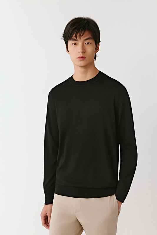 A mid-shot captures the relaxed fit across the shoulders and the refined finish of the neckline.