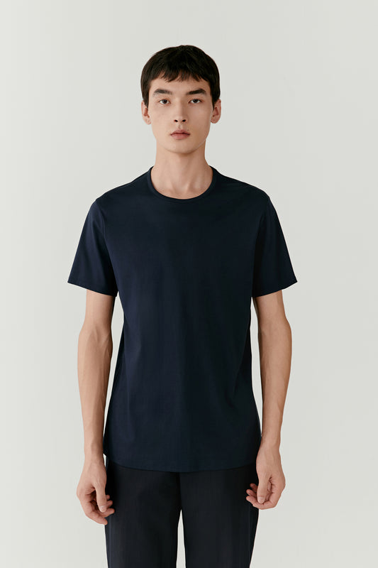 A three-quarter shot highlights the straight cut and timeless simplicity of the silhouette.