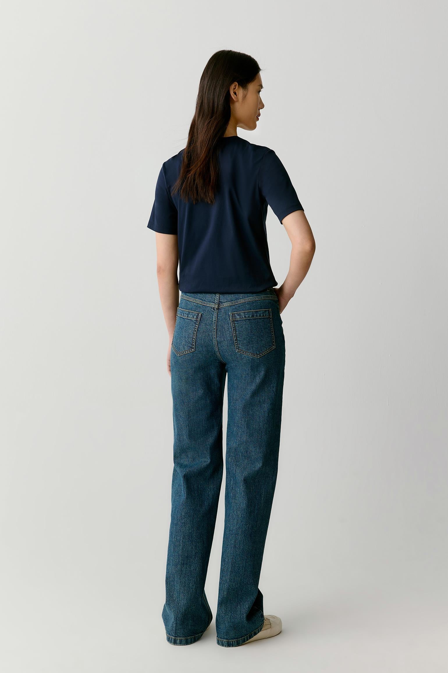 Full-length back view of the cotton jersey T-shirt, showing a smooth back panel, straight hem, and balanced proportions.