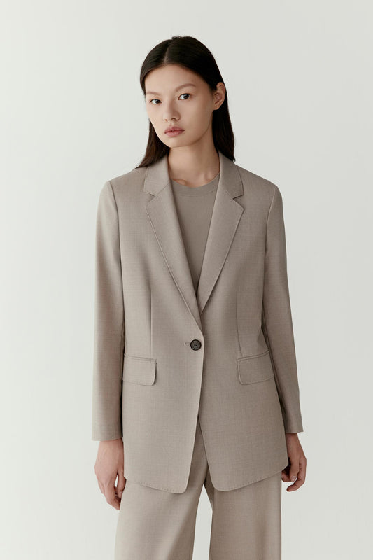 A front view reveals the relaxed and timeless silhouette of this tailor-made ensemble.