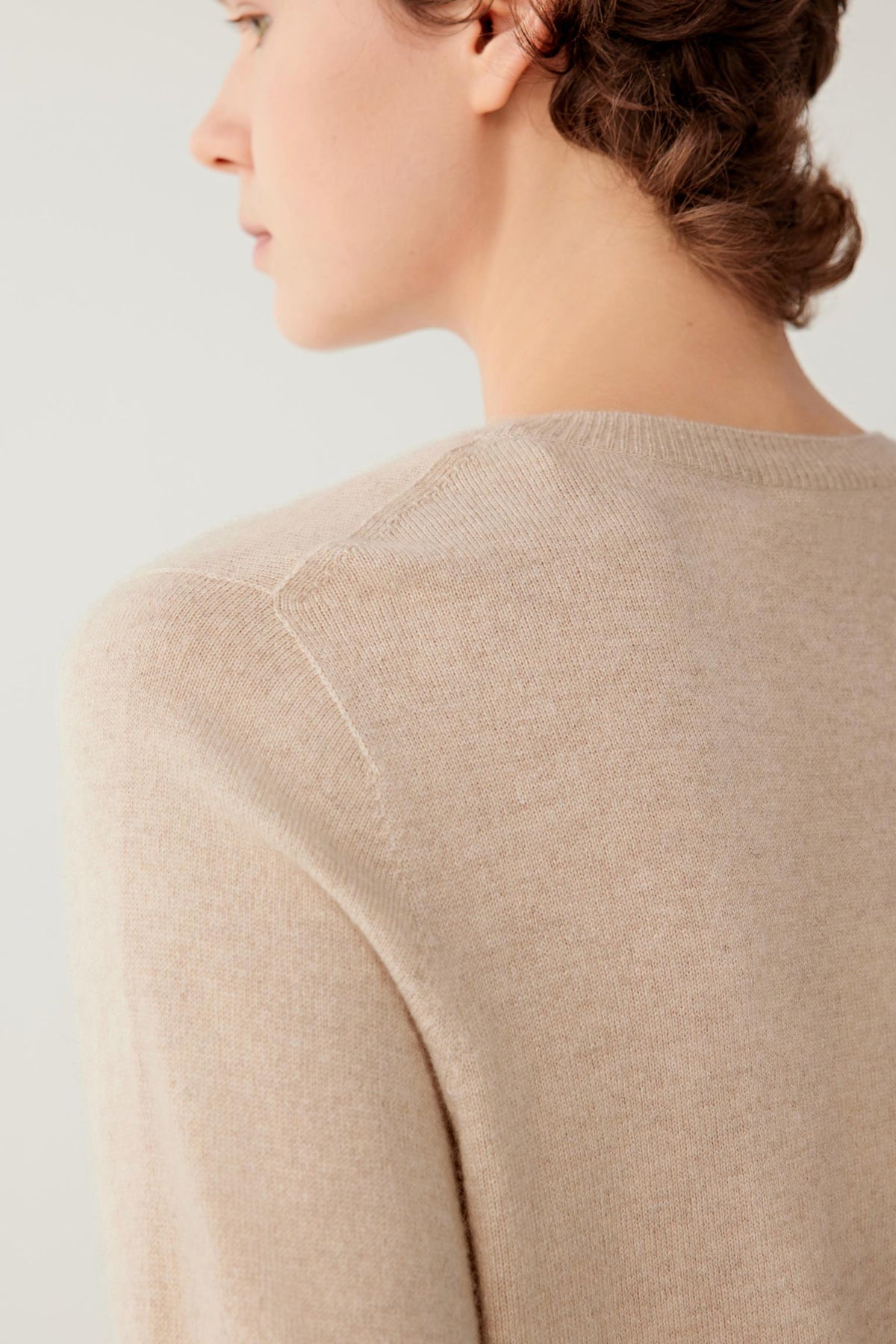 Close-up of the back highlighting the crew neckline, shoulder construction and smooth cashmere surface.