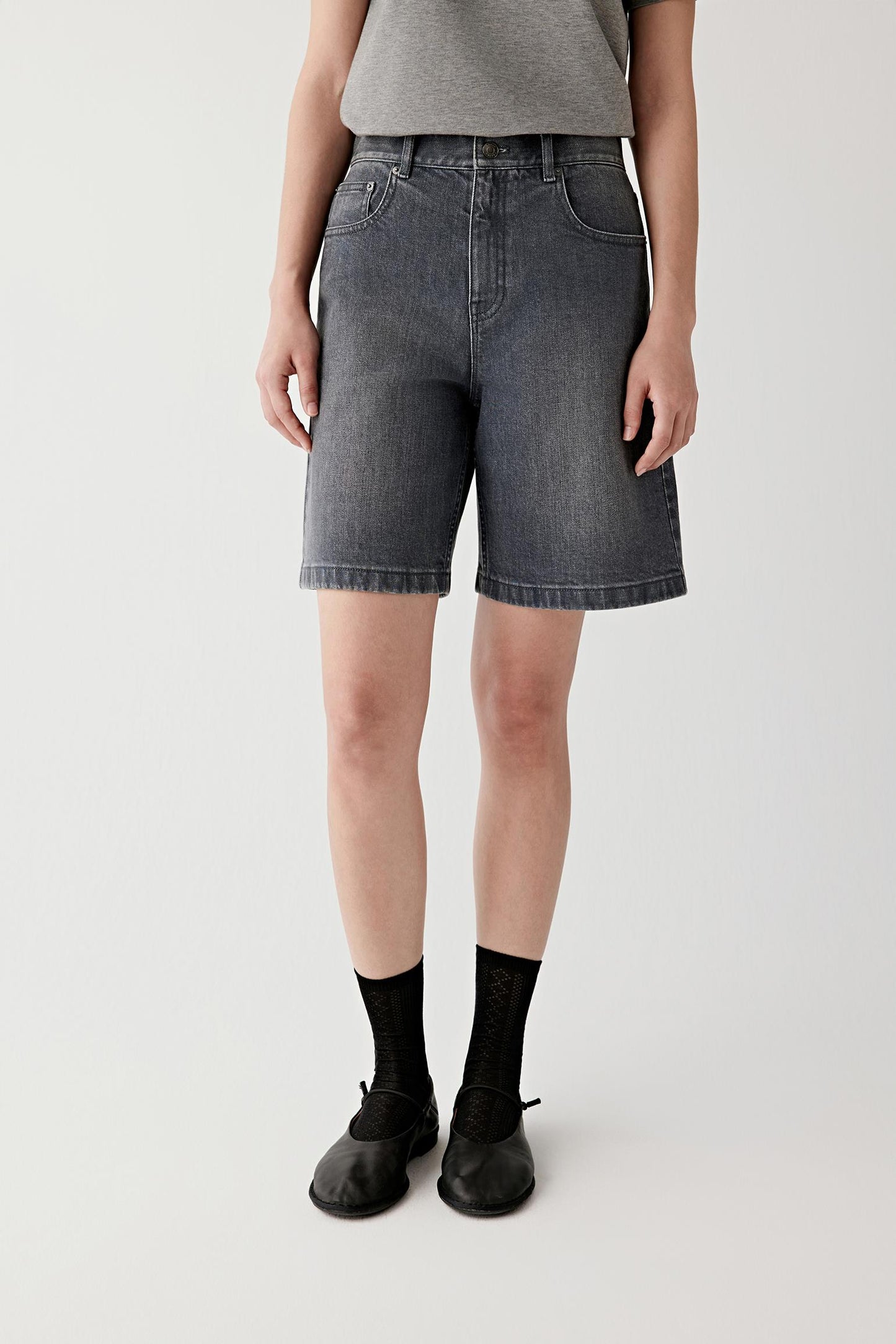 Side view showing mid-thigh length and clean hemline.