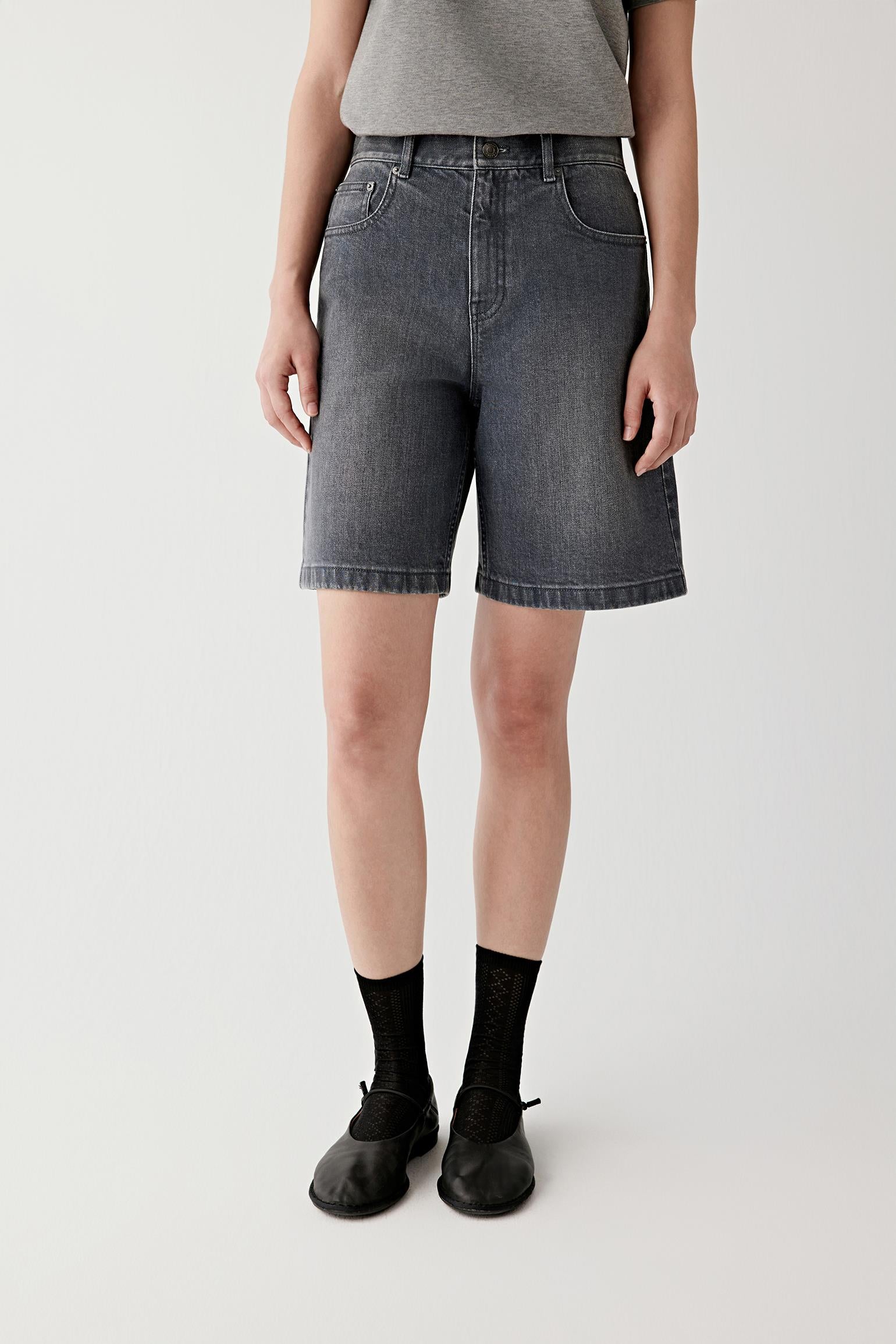 Side view showing mid-thigh length and clean hemline.