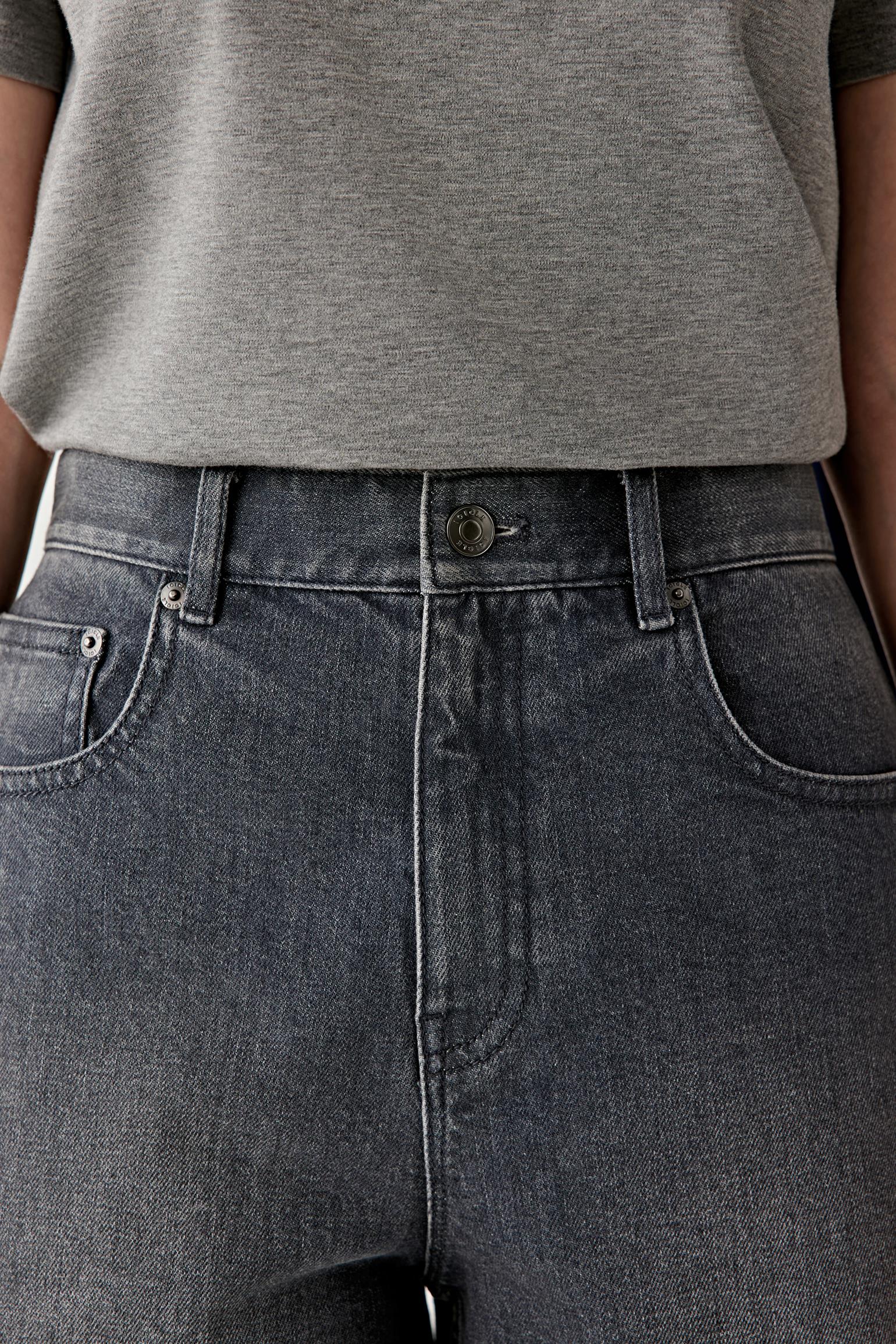 Close-up of waistband and pocket detail, emphasizing texture and stitching.
