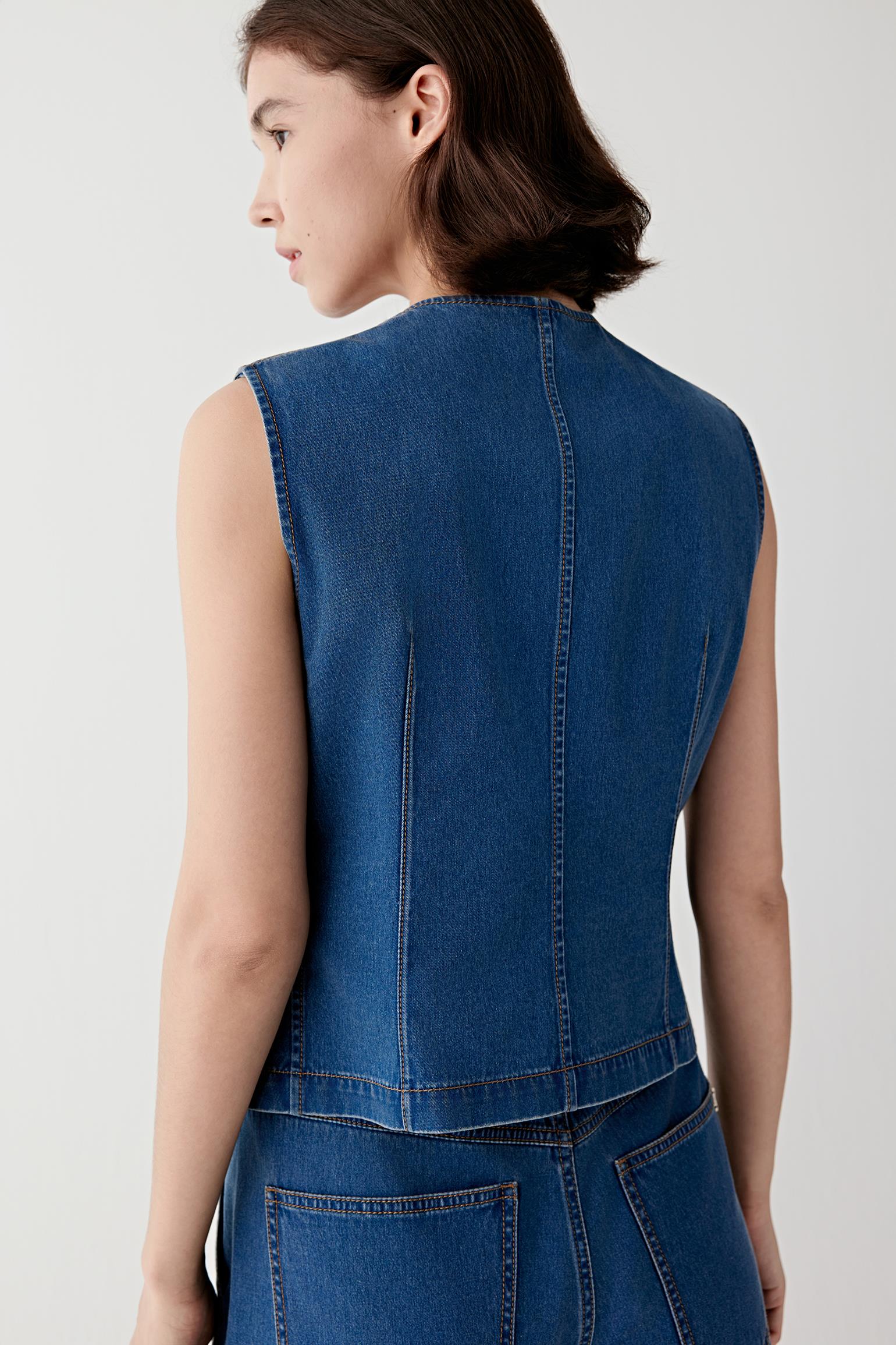 Back view emphasizing the close fit through the back, clean seam lines and slightly tapered waist.