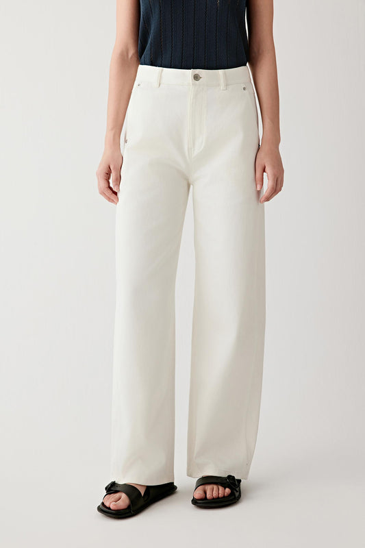 Mid-length front view focusing on the trousers from waist to hem, emphasizing the straight-leg cut, the balanced volume through the leg and the smooth, lightly textured woven denim surface