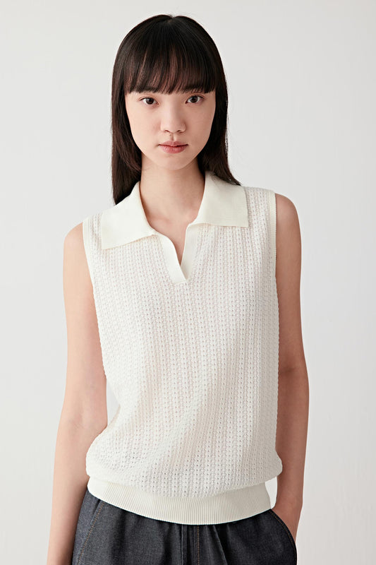Mid-length front view focusing on the upper body, emphasizing the sleeveless cut, polo collar with V opening and the subtly textured openwork knit structure, showing a lightly breathable surface