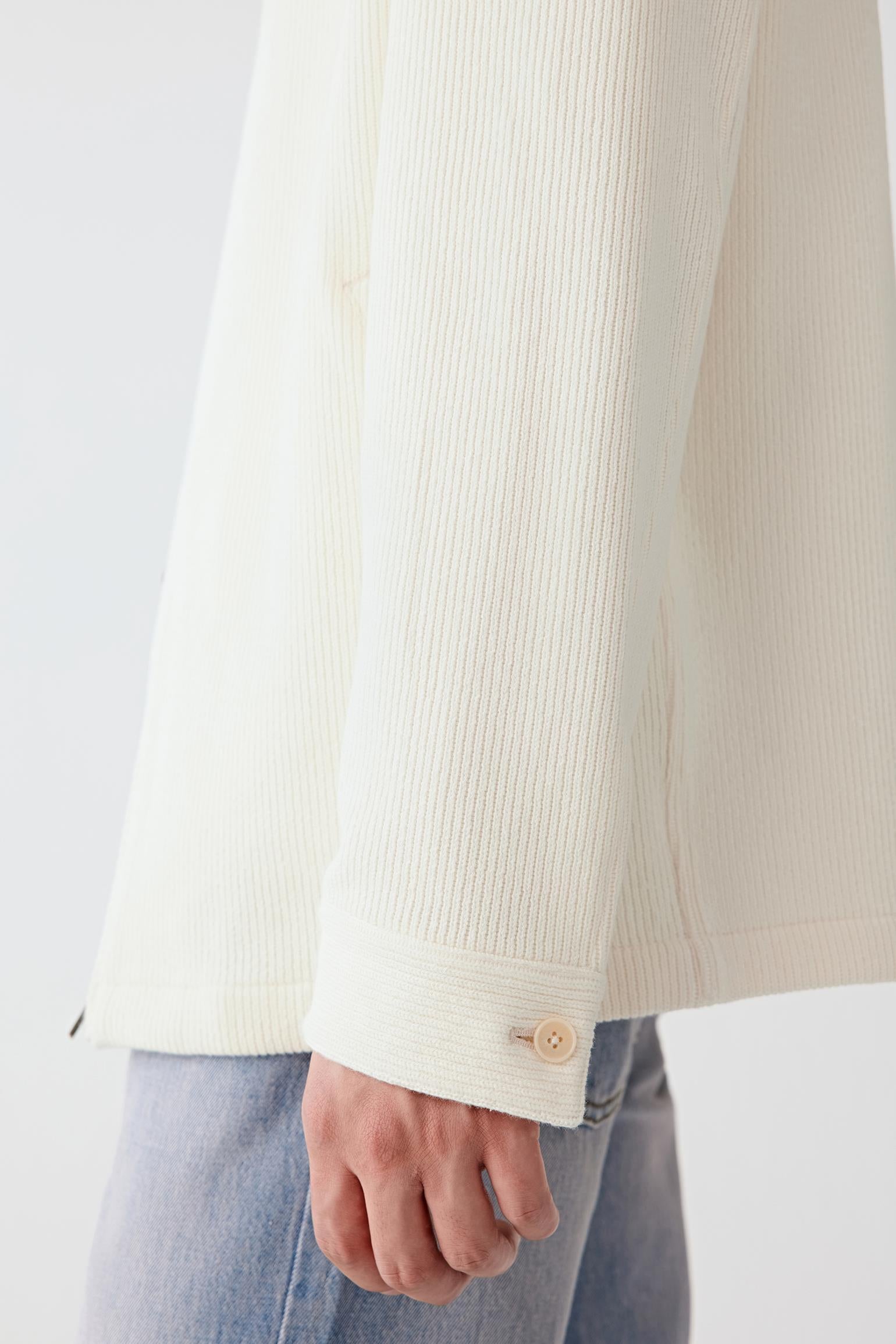 Fabric detail showing the ribbed cotton texture with natural stretch.