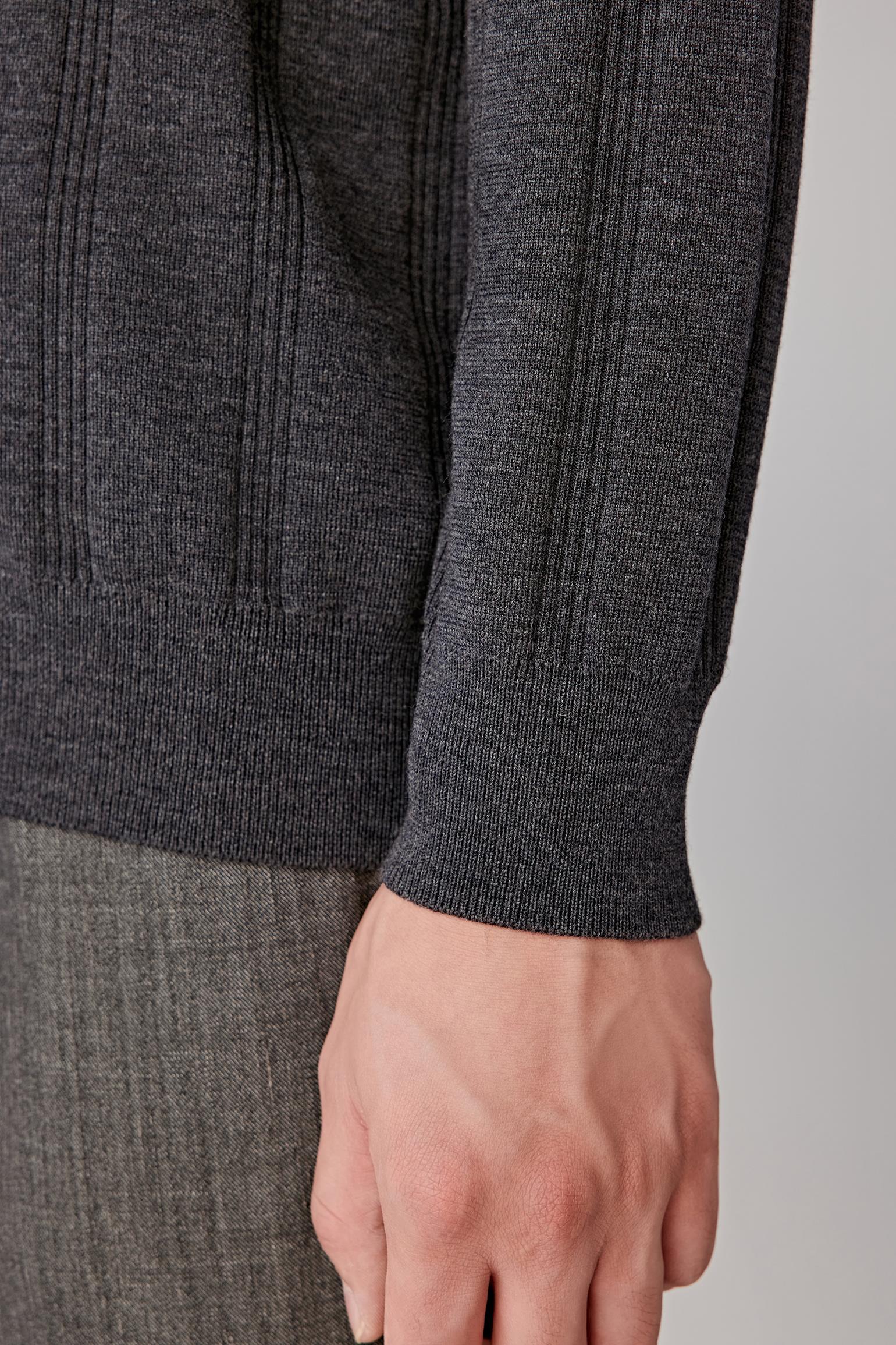 Close-up of the cuff and fine merino knit texture.