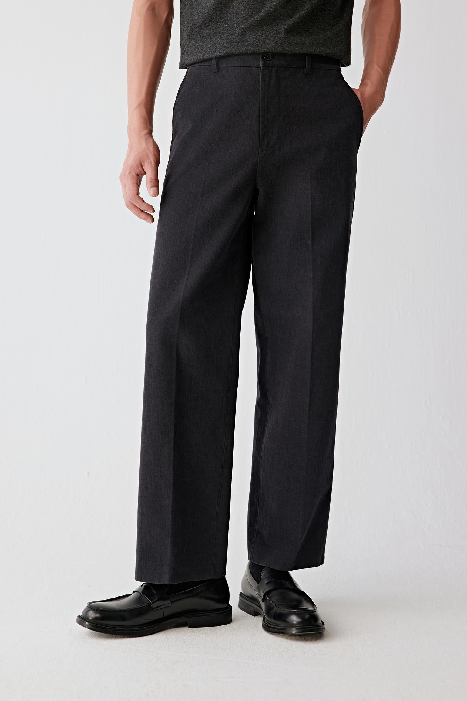 Cropped front view focusing on the upper leg and waist area, highlighting the straight cut and smooth drape from hip to thigh.