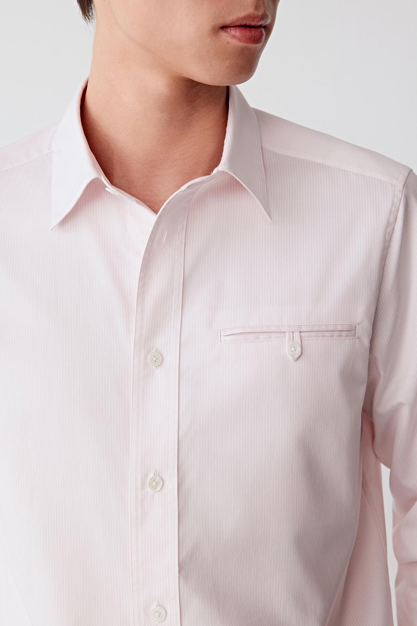 Close-up of the striped cotton twill and classic collar construction.