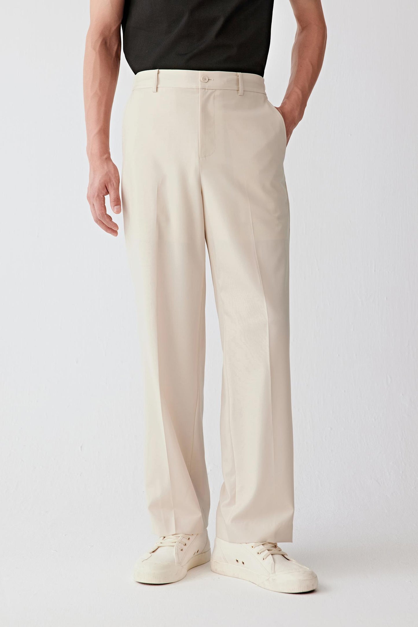 Front view focusing on the clean waistband and fluid leg line.