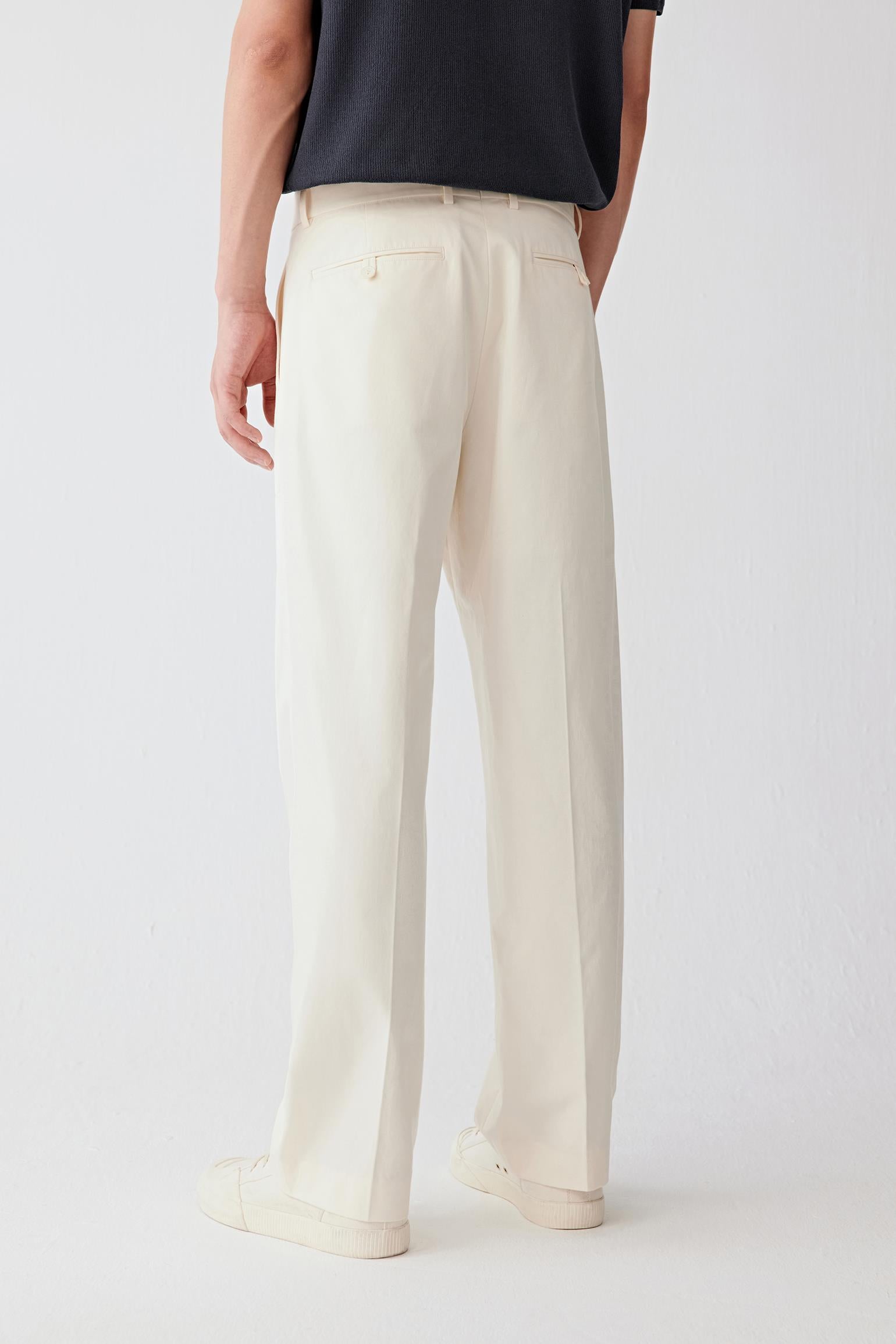 Full-length back view showing the rear silhouette, highlighting the straight cut and continuous vertical fall from waistband to hem, with a balanced structure that maintains shape while remaining breathable