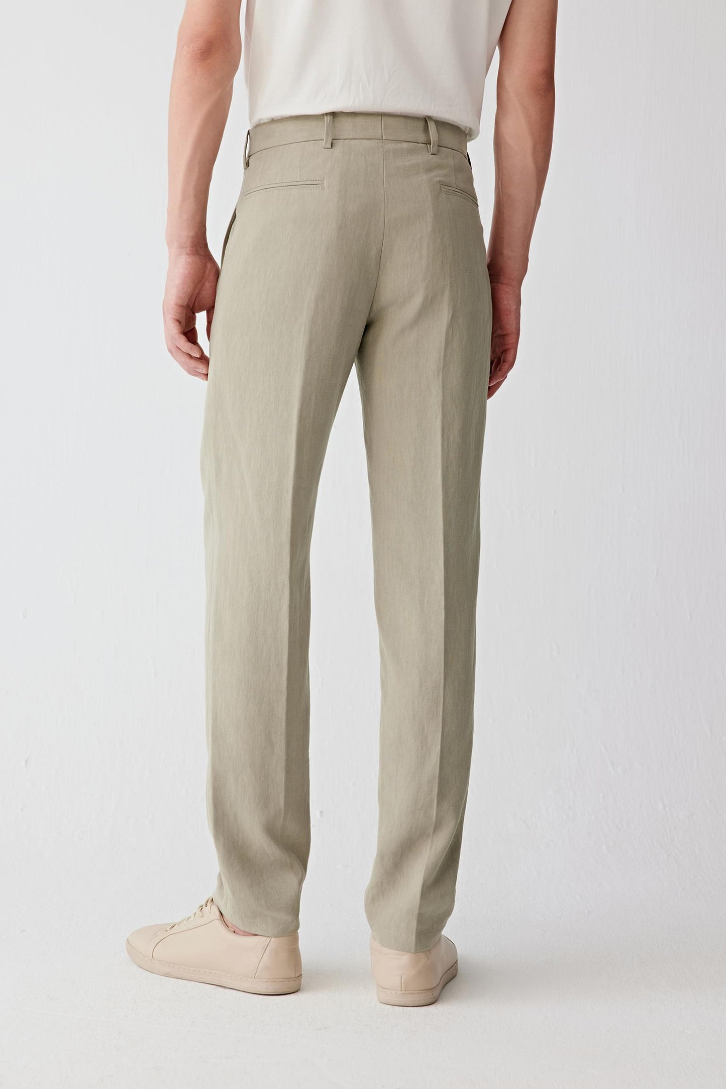 Back view emphasizing the natural ease through the leg and soft movement of the fabric.