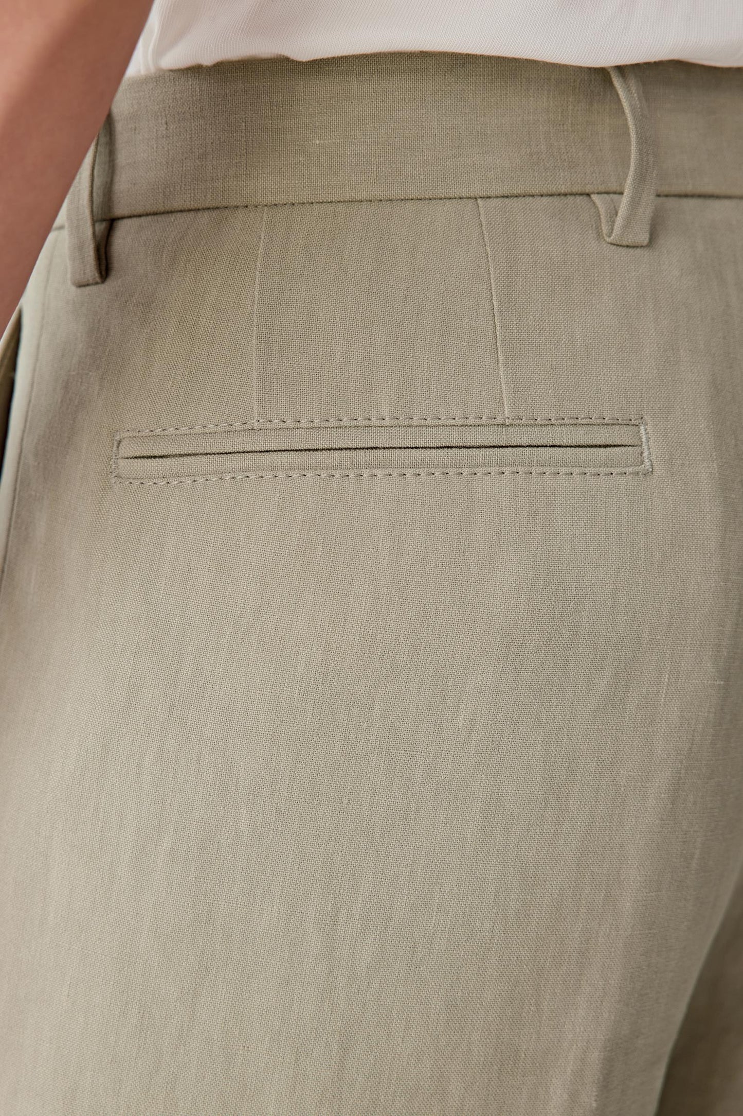 Close-up of the back/hip area highlighting the fabric grain, seam finishing and natural matte appearance.