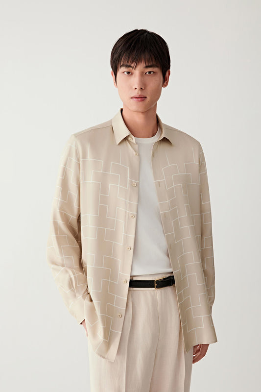 Front three-quarter view emphasizing the relaxed straight cut and fluid silk drape.