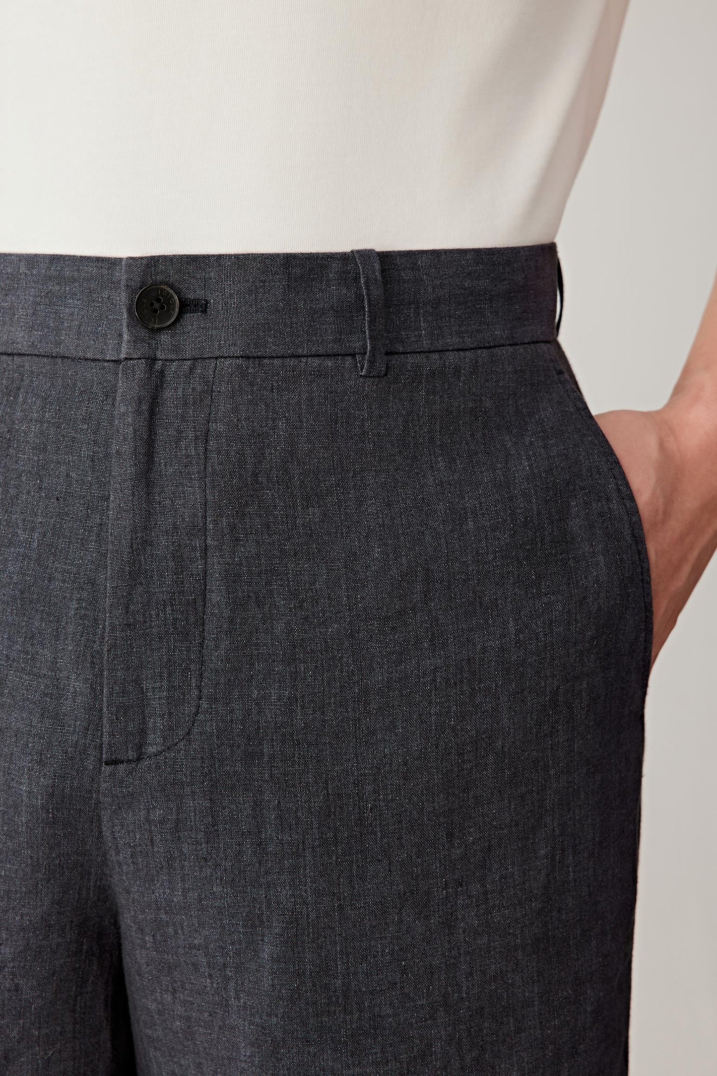 Close-up of the back pocket, highlighting the clean finishing, pocket placement and the slightly crisp texture of the fabric, with visible grain and natural irregularities enhancing the material’s character