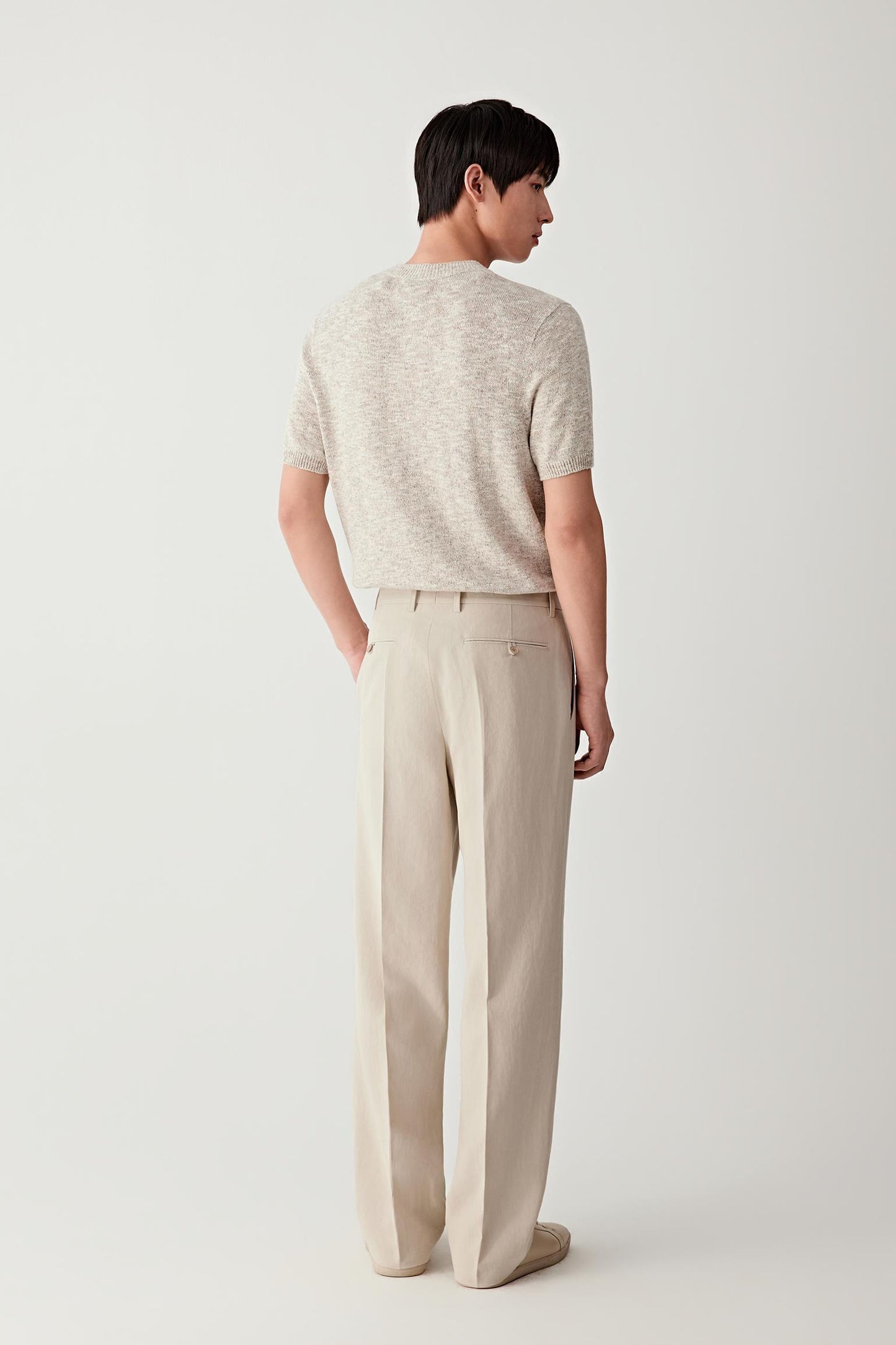Back view highlighting the straight silhouette and lightweight knit.