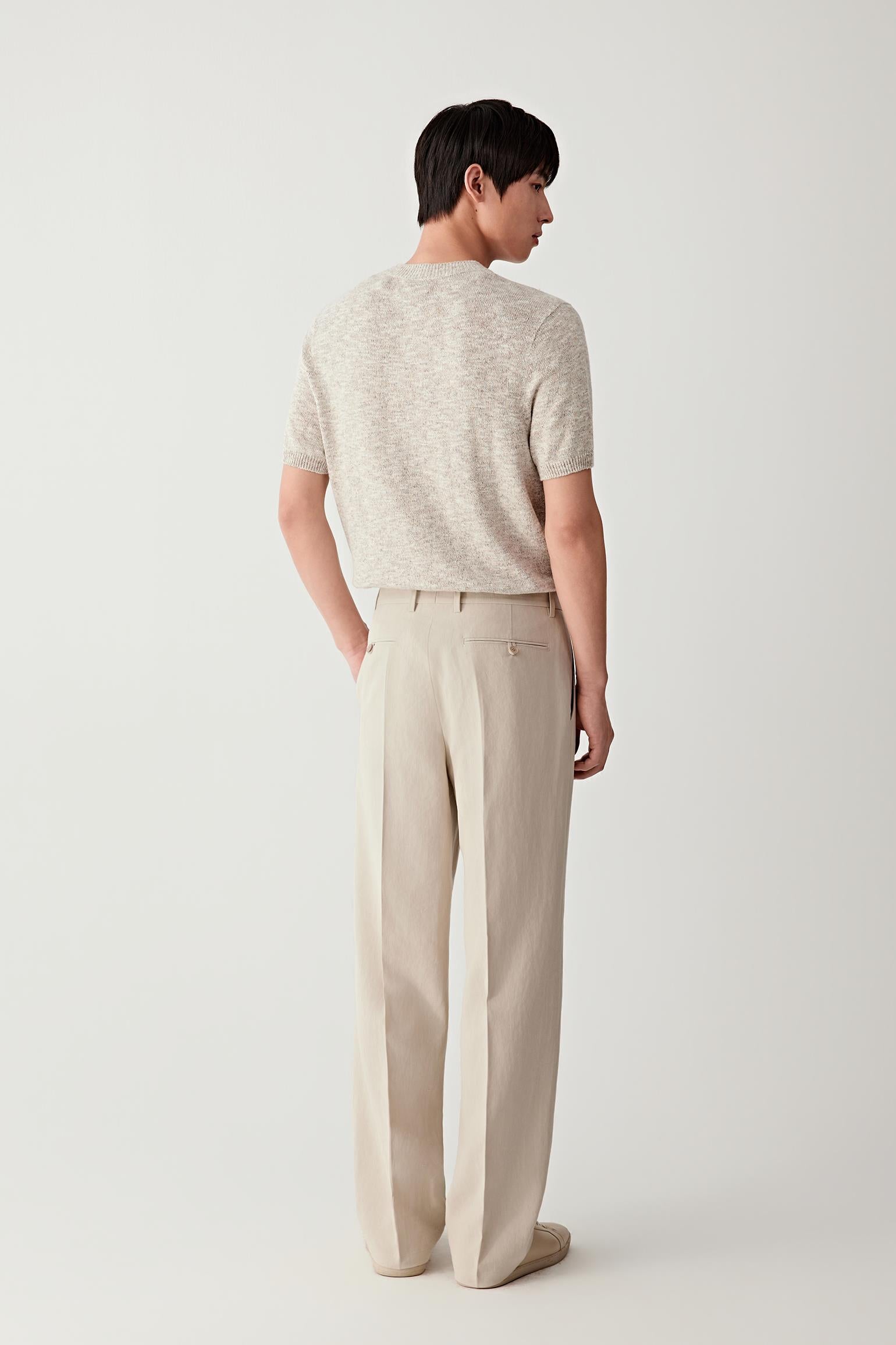 Back view highlighting the straight silhouette and lightweight knit.