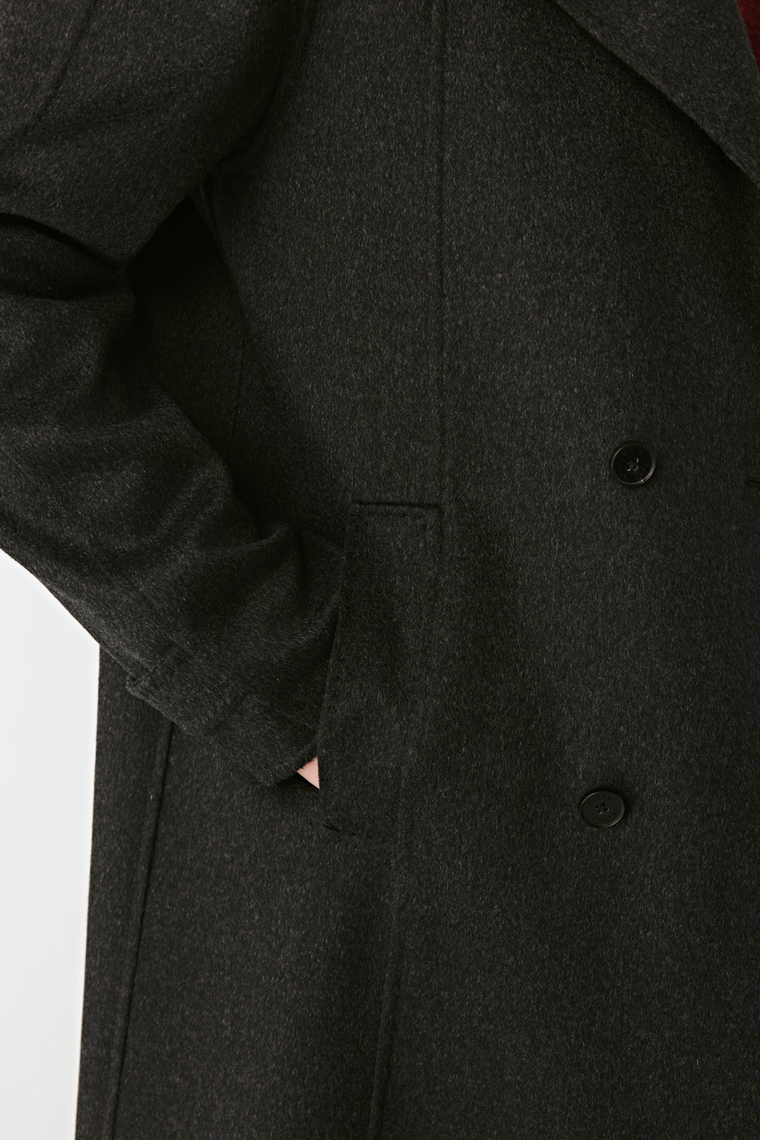 Dark gray coat with buttons on a white background