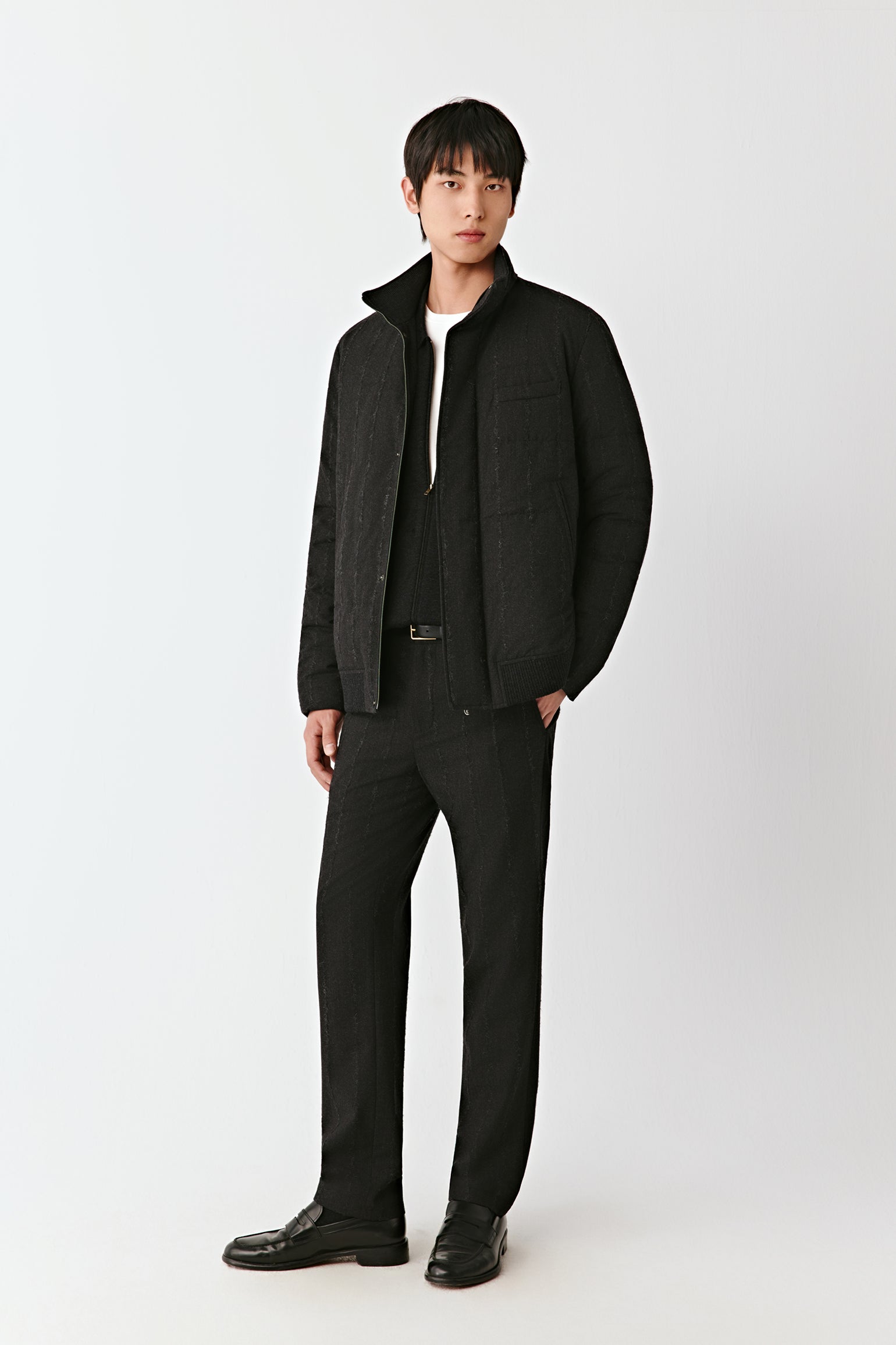 Full-length front view of a dark striped stretch wool down coat with a concealed zip fastening and stand collar.
