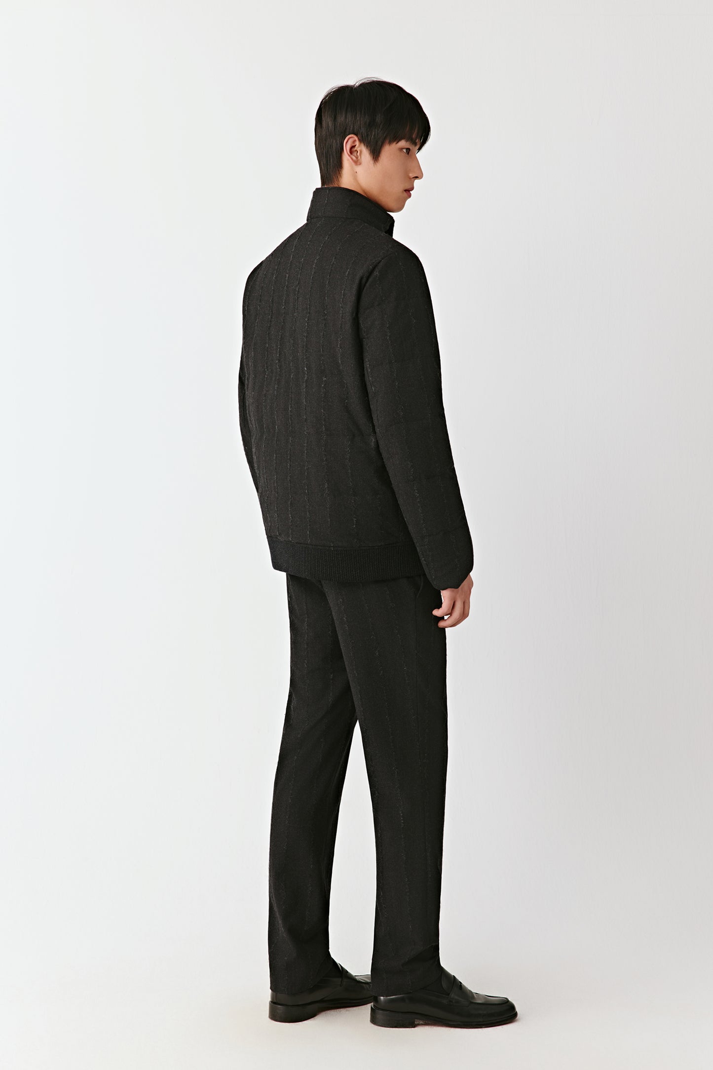 Back view of the striped wool down coat, highlighting the vertical stripe pattern.