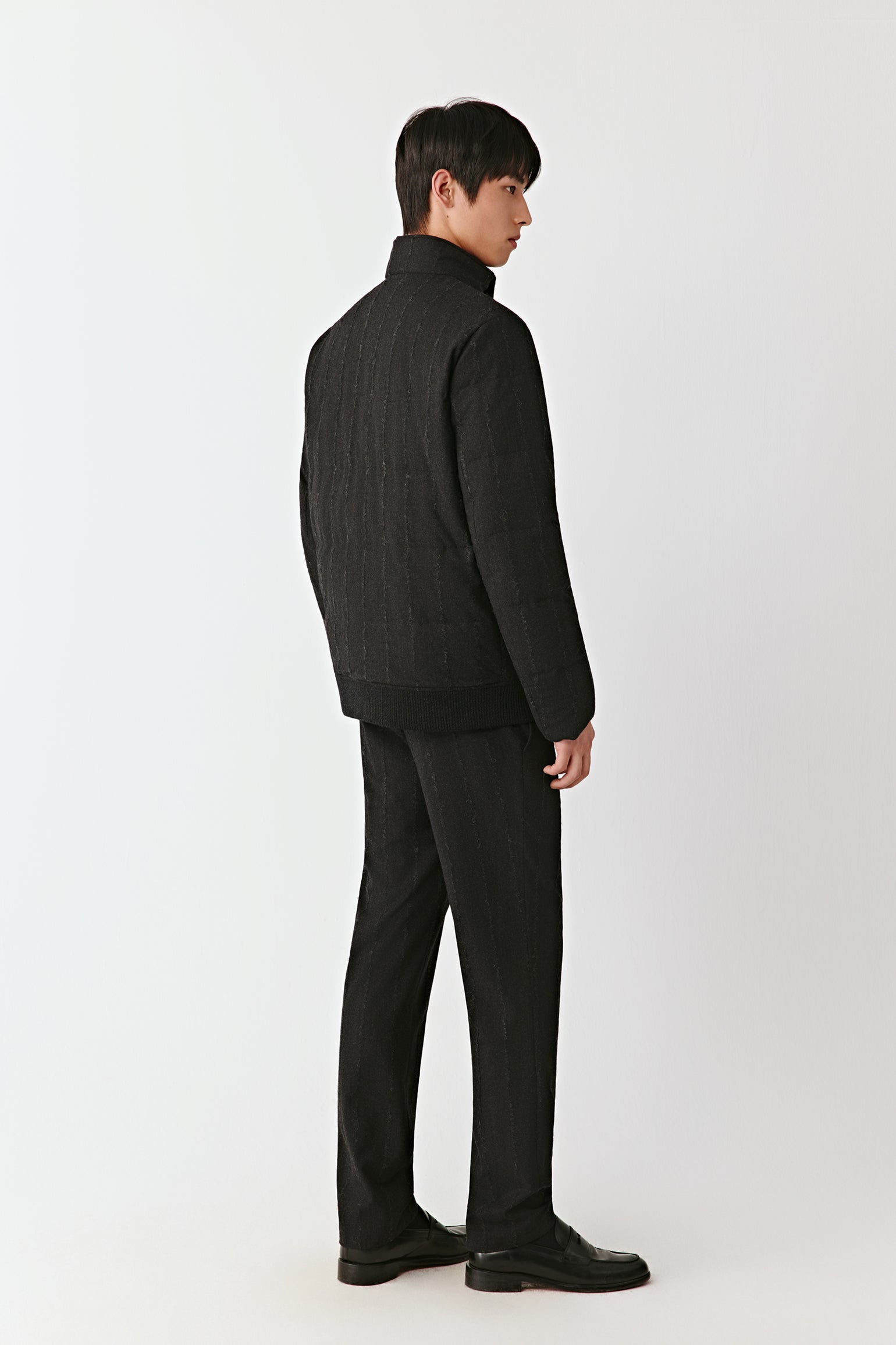 Back view of the striped wool down coat, highlighting the vertical stripe pattern.