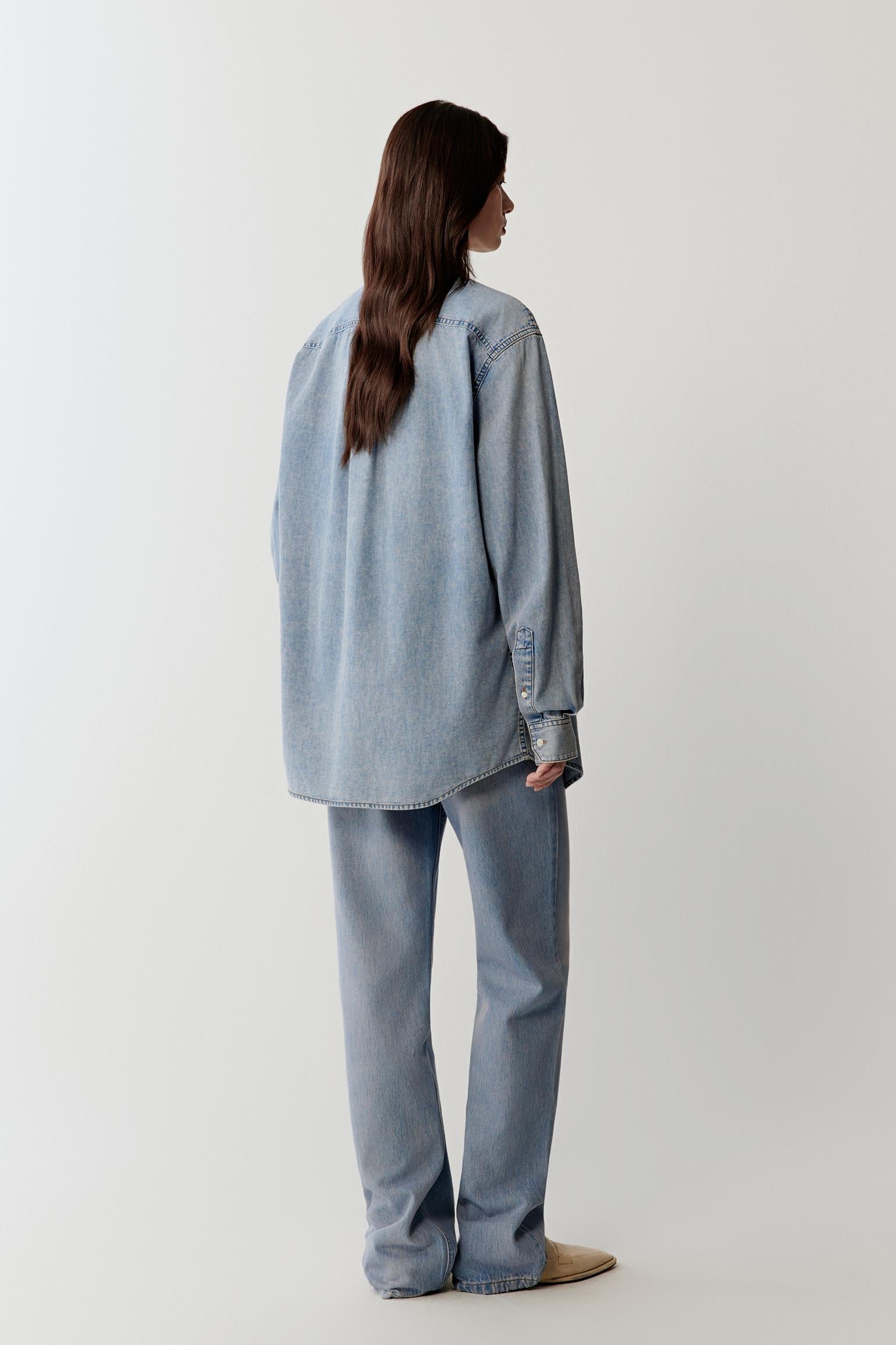 Full-length back view emphasizing the clean back panel, straight cut, soft drape from shoulders to hem and subtle color variations in the fabric
