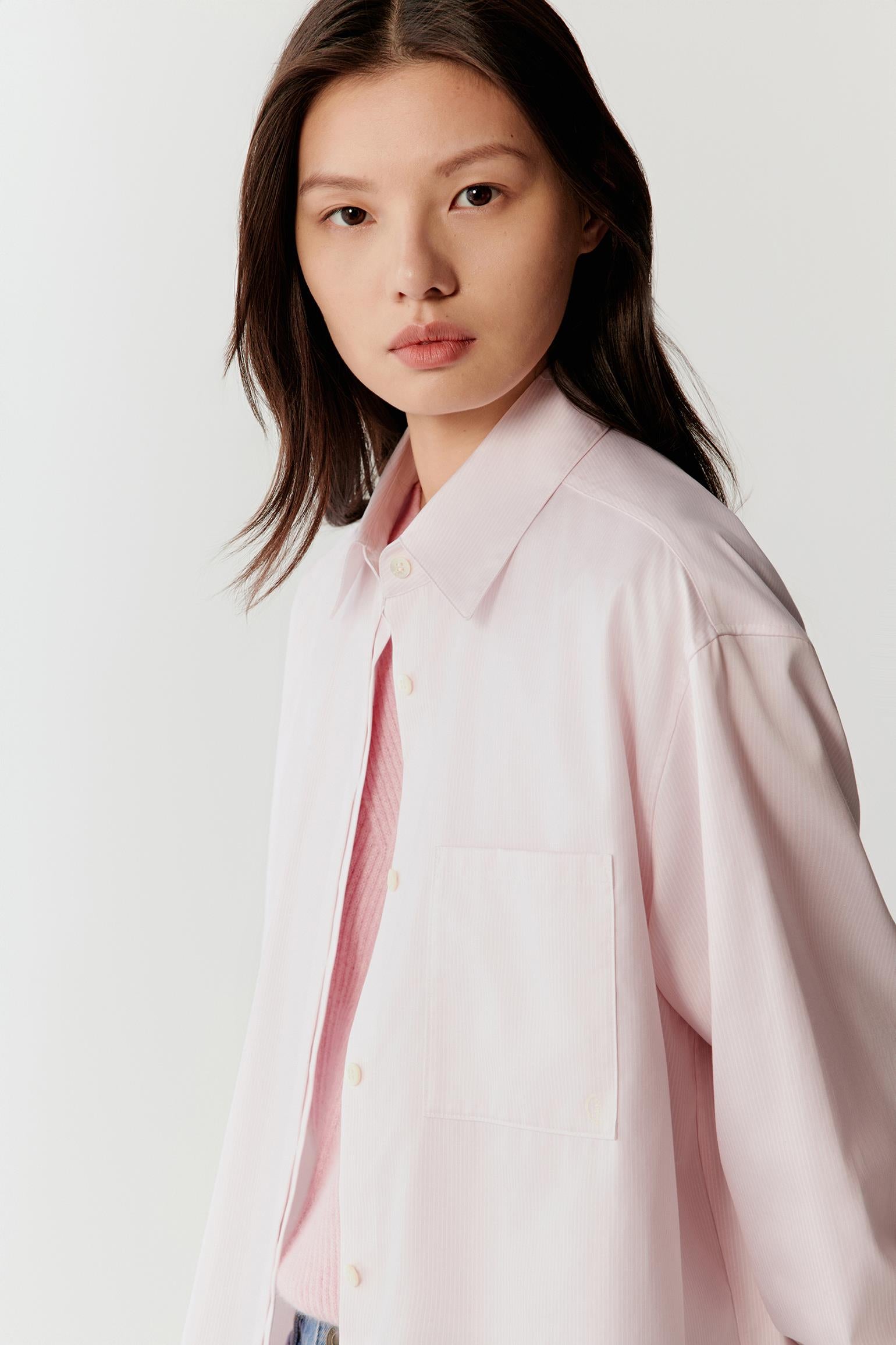 Side view highlighting the relaxed silhouette and the lightweight drape of the cotton twill fabric.