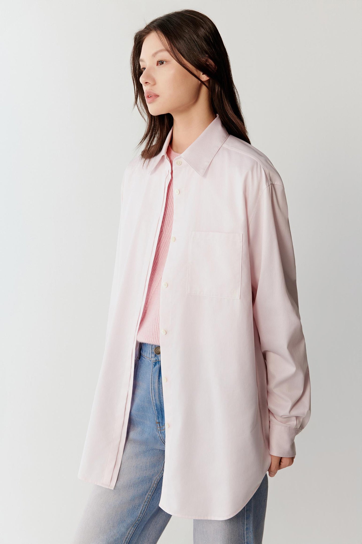 Side view highlighting the relaxed silhouette and the lightweight drape of the cotton twill fabric.