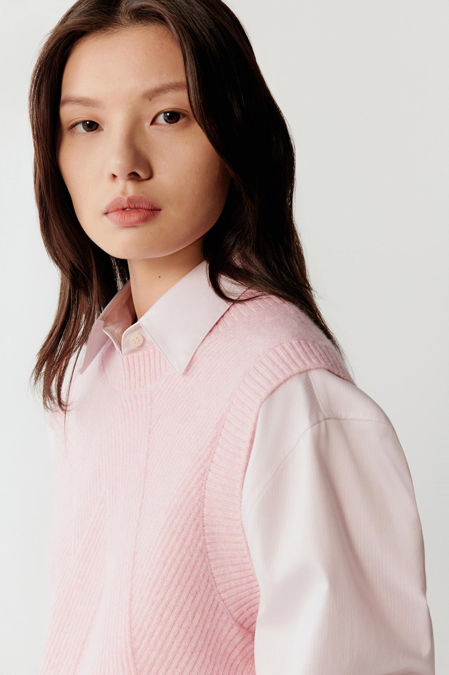 Close-up of neckline and fine knit texture.