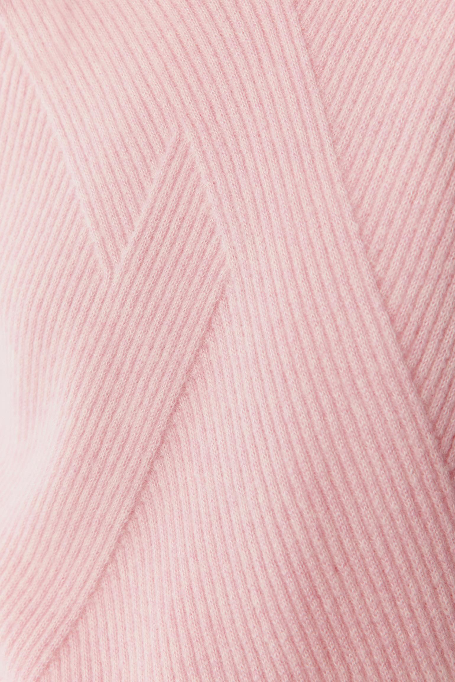 Fabric detail showing the delicate pink melange yarn blend.