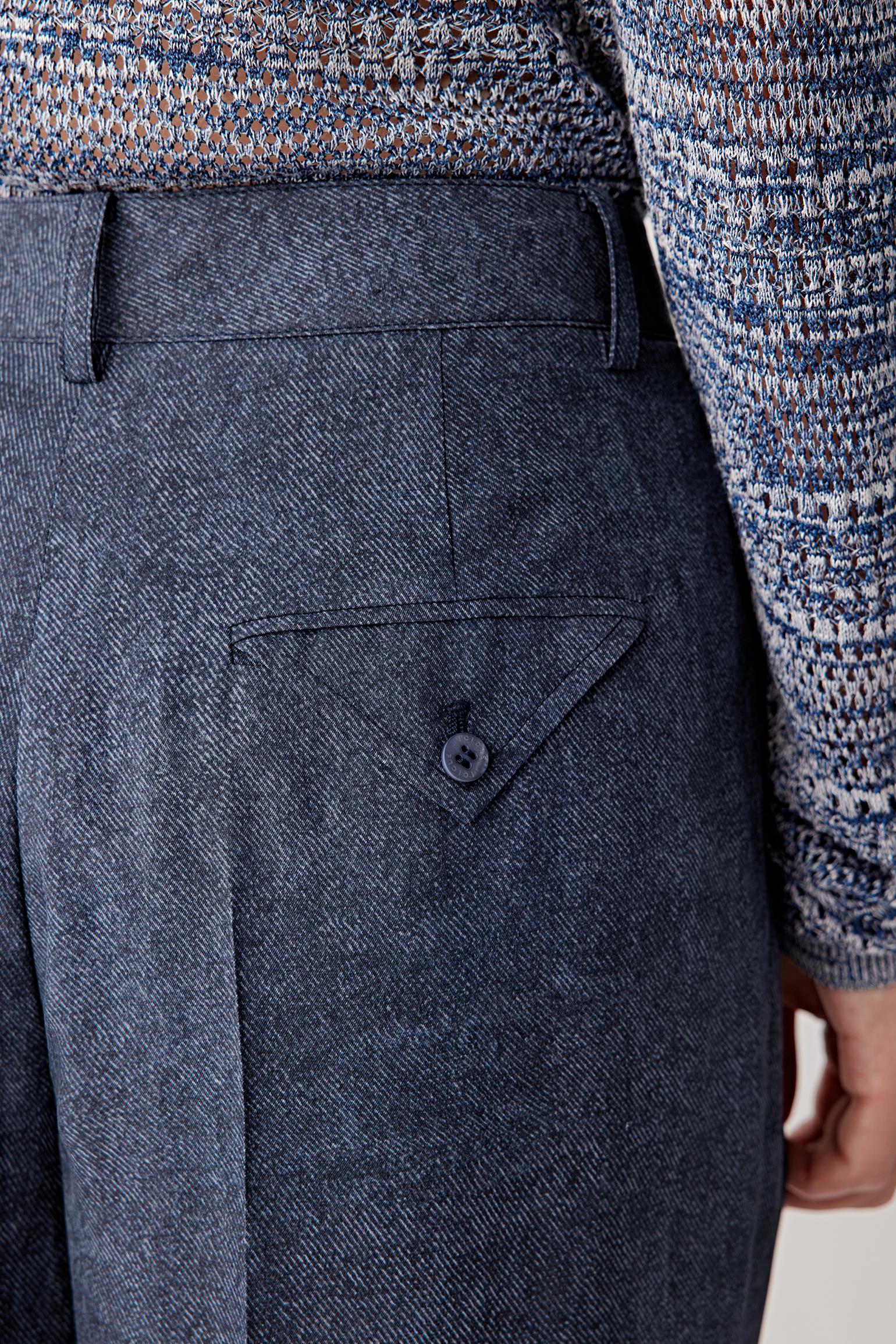 Close-up of hip and side seam showing the smooth silk surface, visible stitching and the refined drape created by the lightweight twill construction