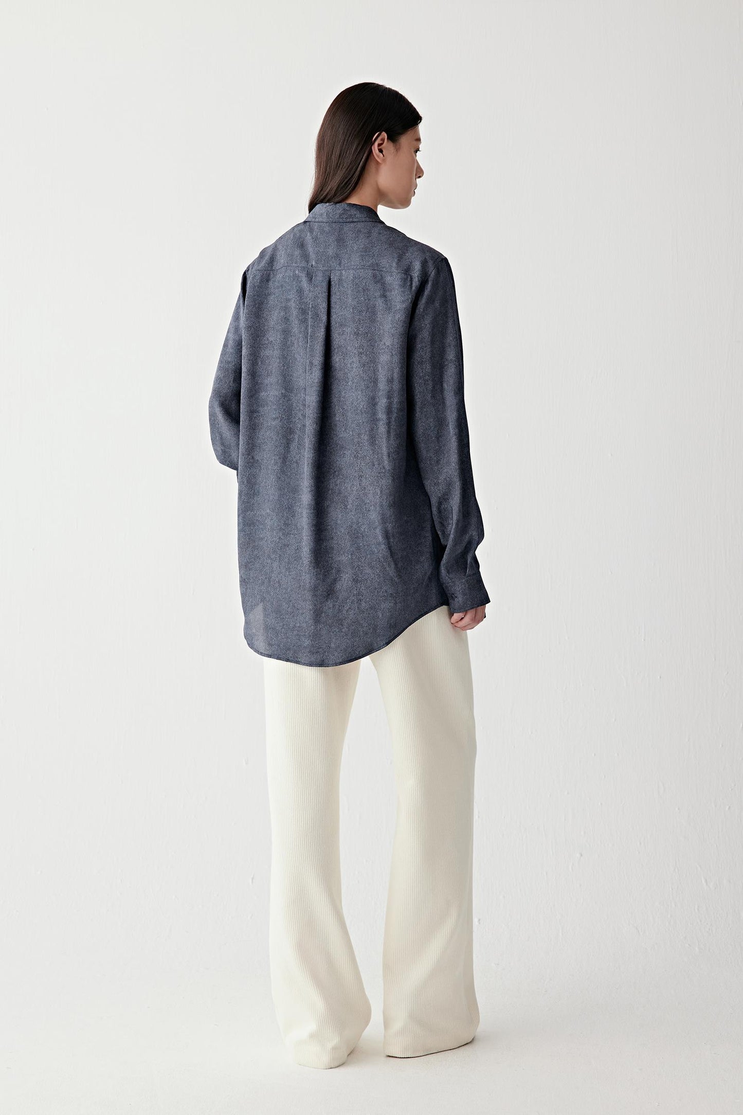 Full-length back view highlighting the clean rear construction, straight silhouette and fluid drape through the lightweight silk twill fabric