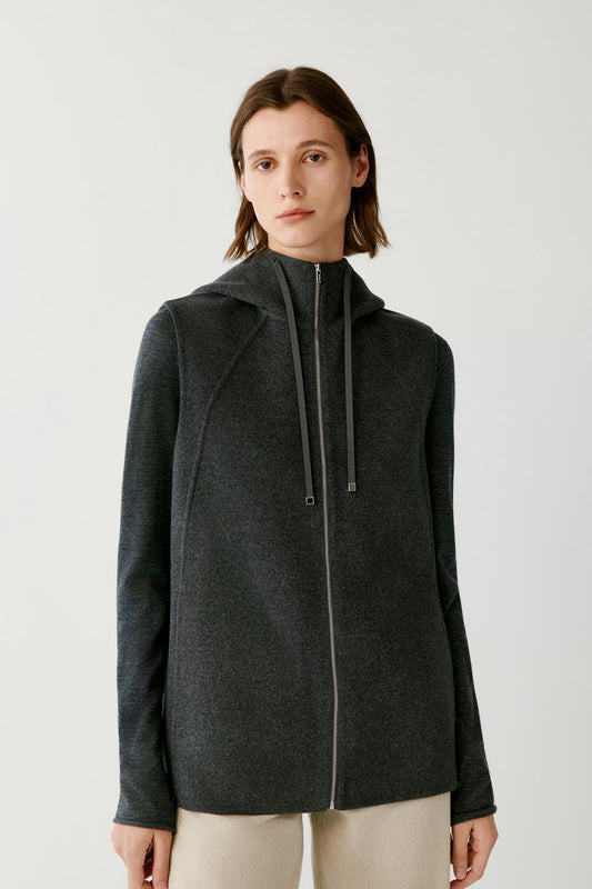 Front view highlighting the hood, sleeveless construction and two-way zip fastening of the dark grey melange coat.