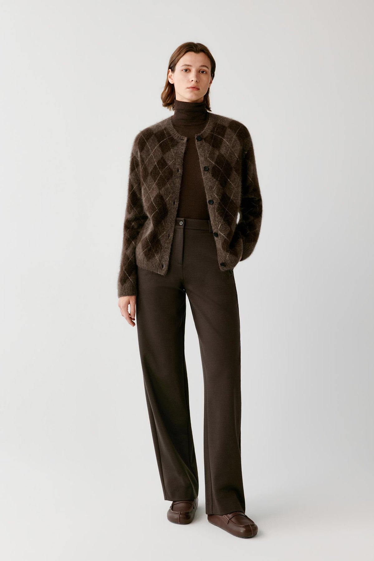 Front full-length view of a woman wearing the dark brown yak cardigan, highlighting the straight silhouette and long sleeves.