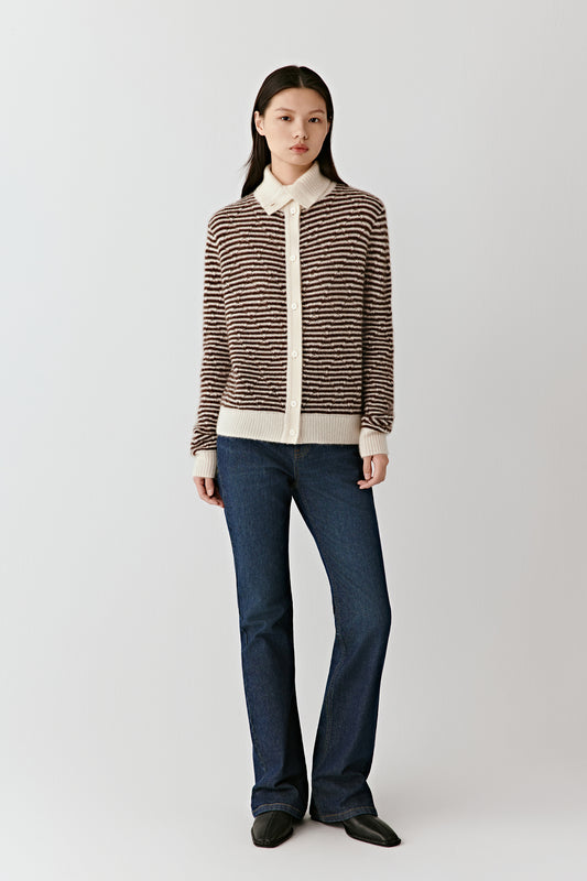 Full-length front view of a person wearing the striped cashmere-silk cardigan with a contrasting cream collar, paired with jeans.